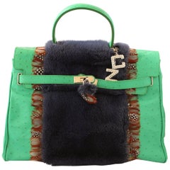 Bolso Carlo Zini de piel estampada de avestruz con visón
