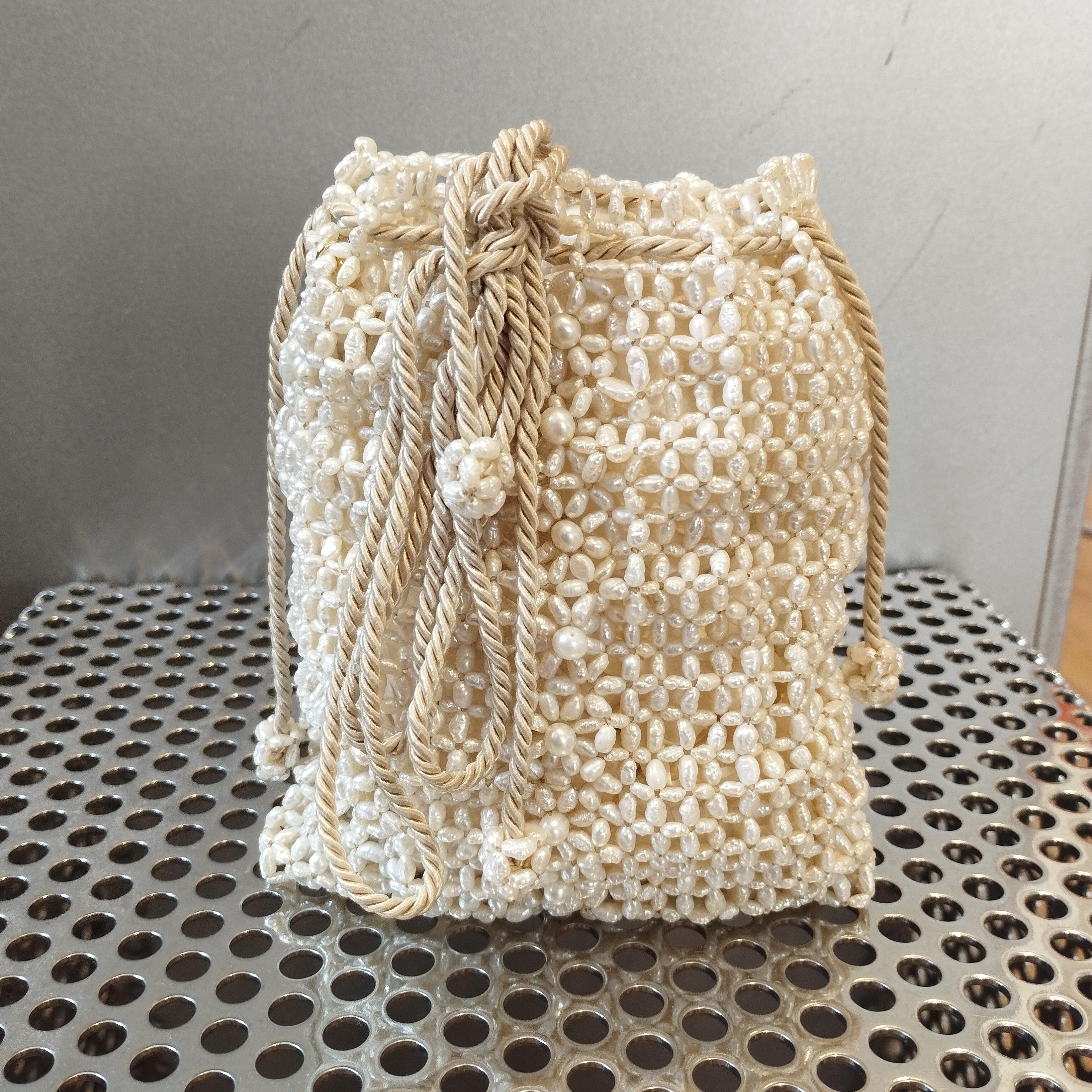 This is a world unique piece made by the legendary Carlo Zini
Completely made in hte best italian artianal way
River pearls embroidered one by one
Can be worn crossbody
Cm 12 x 15 (4,72 x 5,9 inches)
It is a perfect piece for an elegant dinner or a