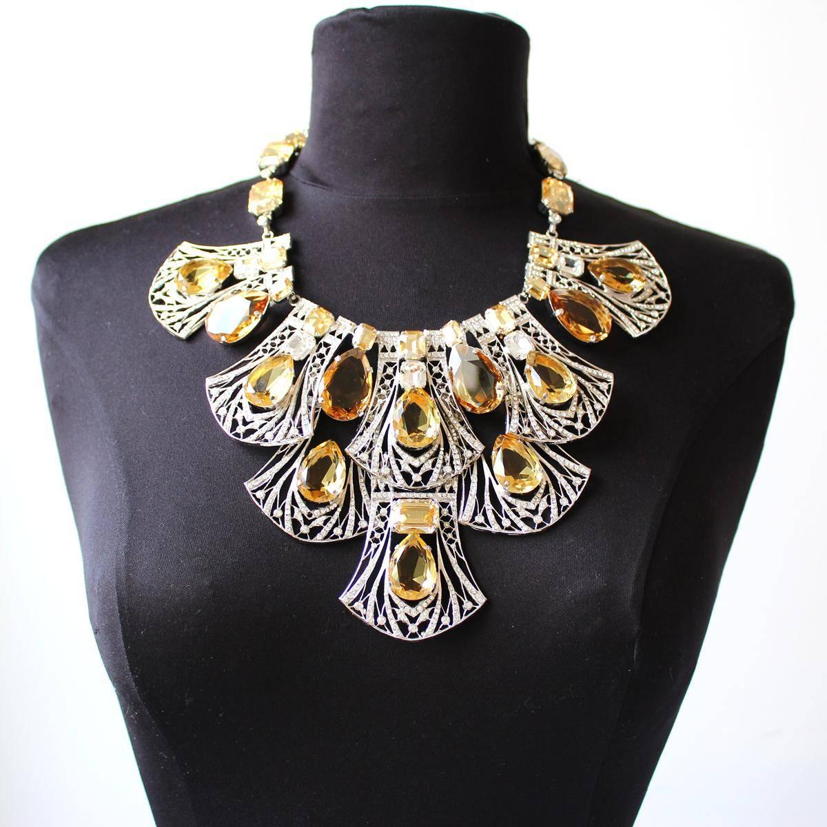 Fantastic masterpiece by Carlo Zini
One of the world greatest bijoux designers
Large collier
Stunning construction of topaze like elements and swarovski crystals
Non allergenic metal, worked with rhodium
100% Artisanal work, made in Milan
Worldwide