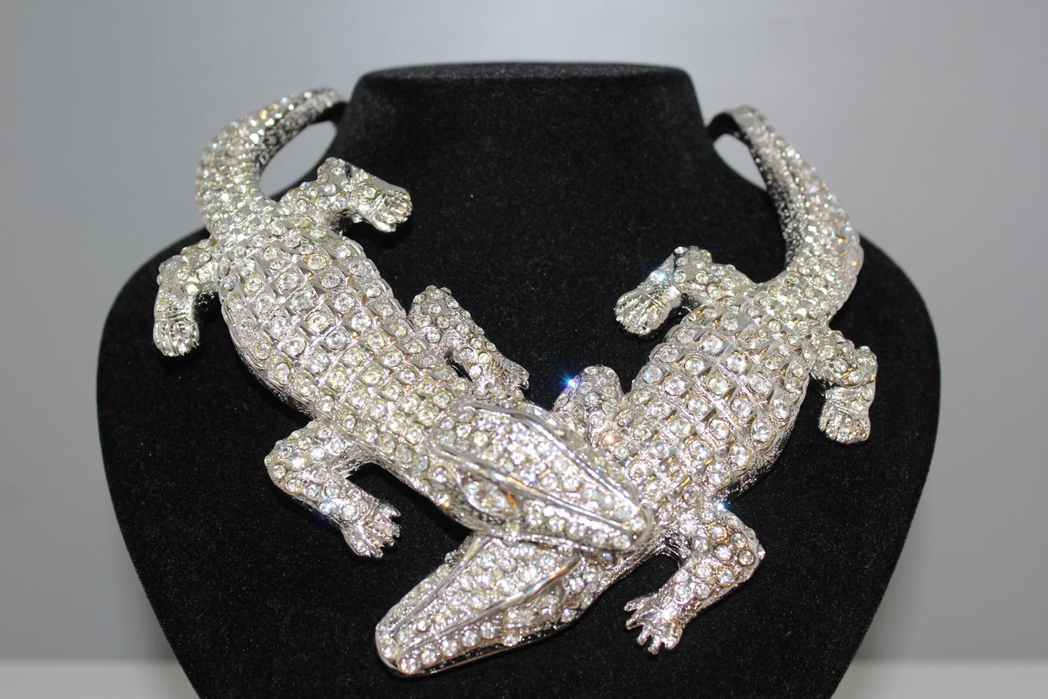 Fantastic masterpiece by Carlo Zini
One of the world greatest bijoux designers
Iconic piece, 2 crocodiles
Non allergenic rhodium
Amazing hand creation of  Swarovski crystals 
100% Artisanal work
Made in Milano
Worldwide express shipping included in