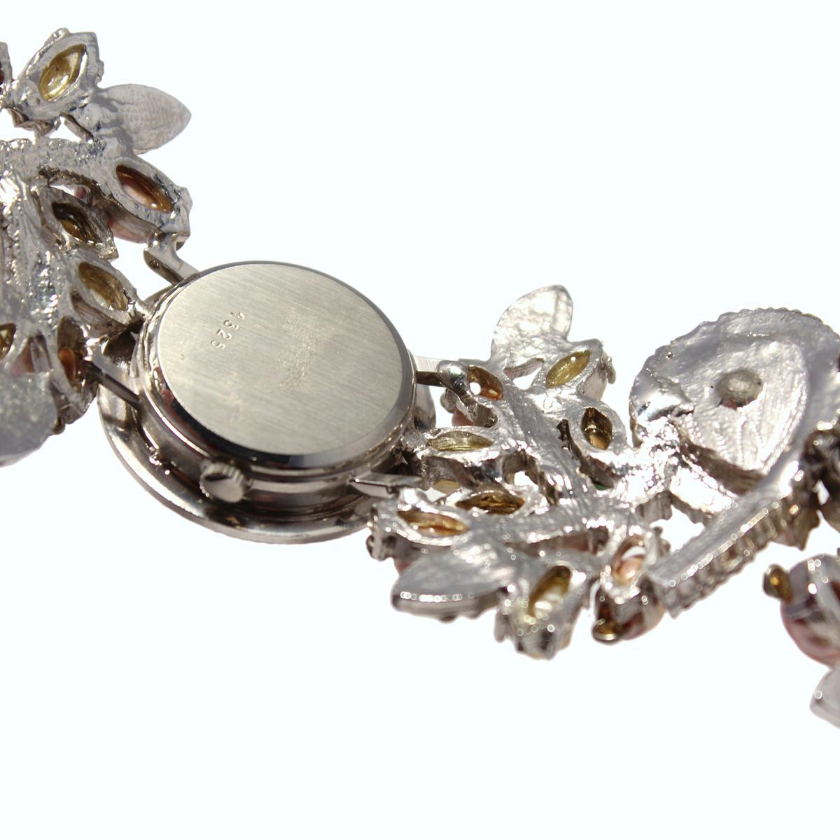 Amazing Carlo Zini Milano jewel watch 
One of the greatest bijoux creators of all times
Vintage from late 80's / early 90's
Perfectly working
Quartz movement
Silver color
Precious rhinestones, crystals and colored resins worked strap
Round