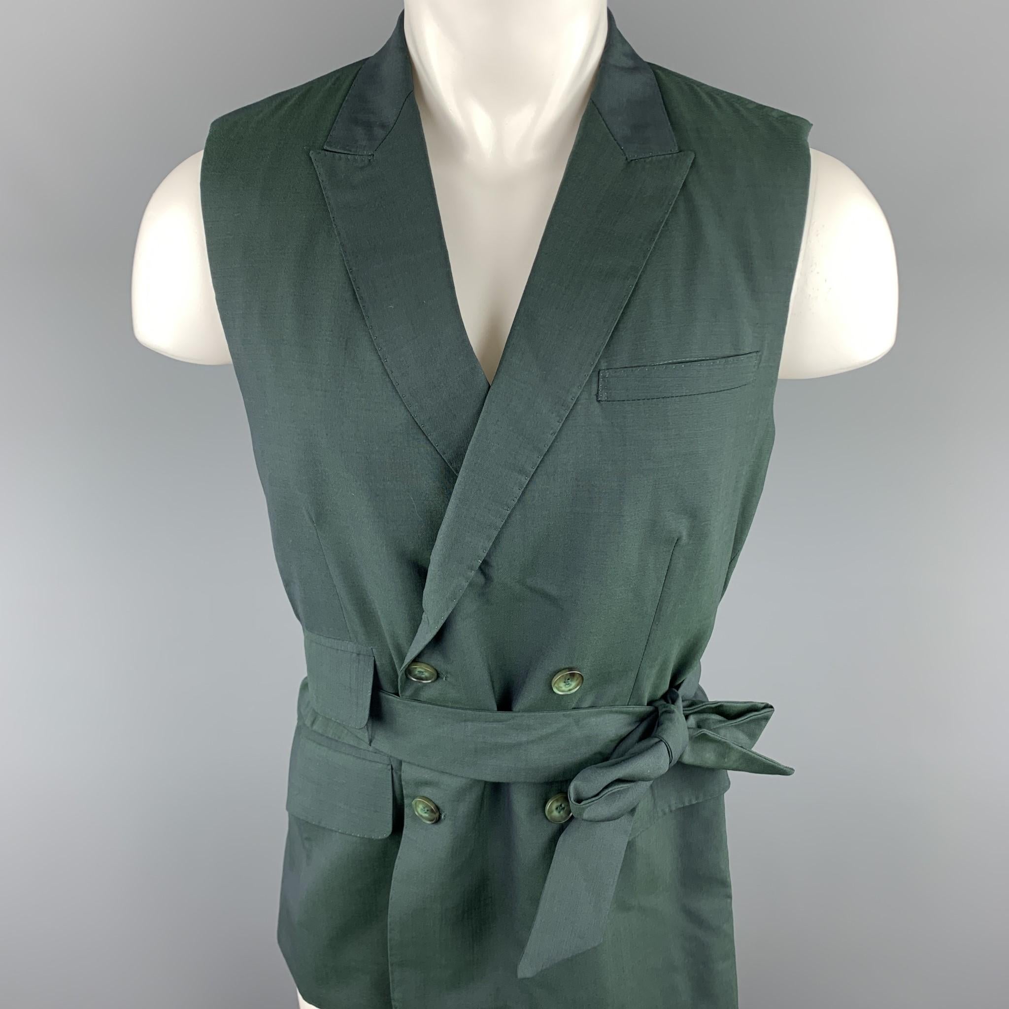 CARLOS CAMPOS vest comes in a forest green wool featuring a belted style, peak lapel, flap pockets, and a double breasted closure. 

Very Good Pre-Owned Condition.
Marked: No Size Marked 

Measurements:

Shoulder: 15 in. 
Chest: 38 in. 
Length: 30