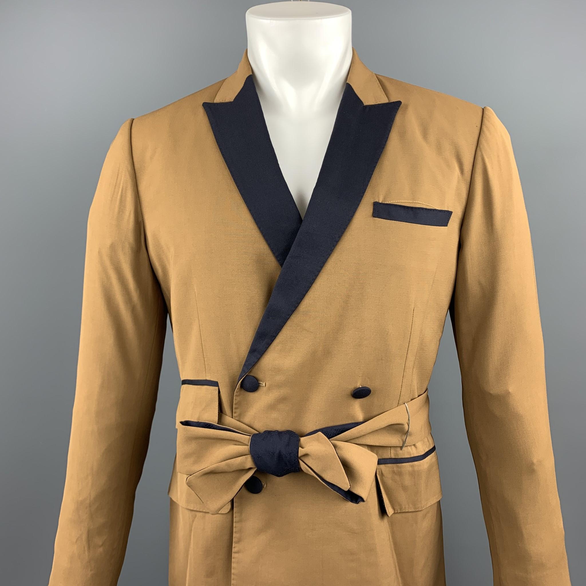 CARLOS CAMPOS sport coat comes in a tan & navy two toned wool featuring a peak lapel style, belted, flap pockets, and a double breasted closure.

Excellent Pre-Owned Condition.
Marked: No Size Marked

Measurements:

Shoulder: 16 in. 
Chest: 38 in.