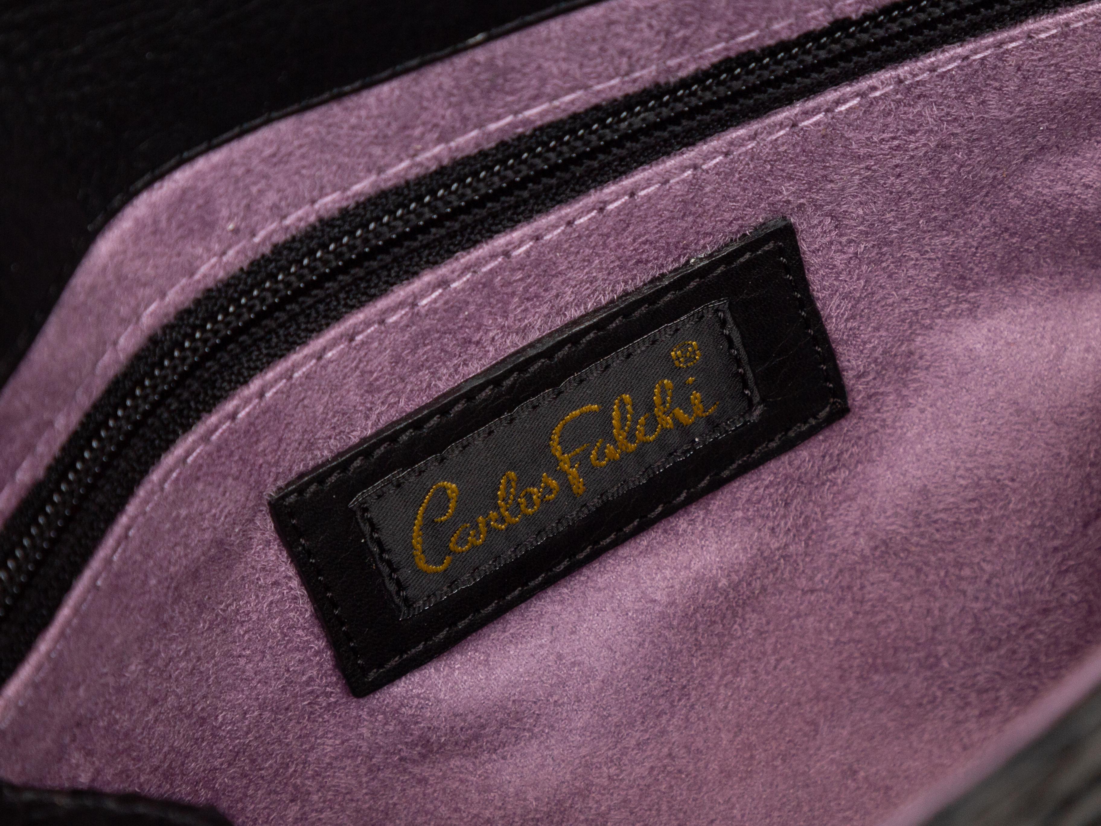 Product details: Black python clutch by Carlos Falchi. Purple suede interior. Interior zip pocket. Optional silver-tone chain-link shoulder strap. 14.5