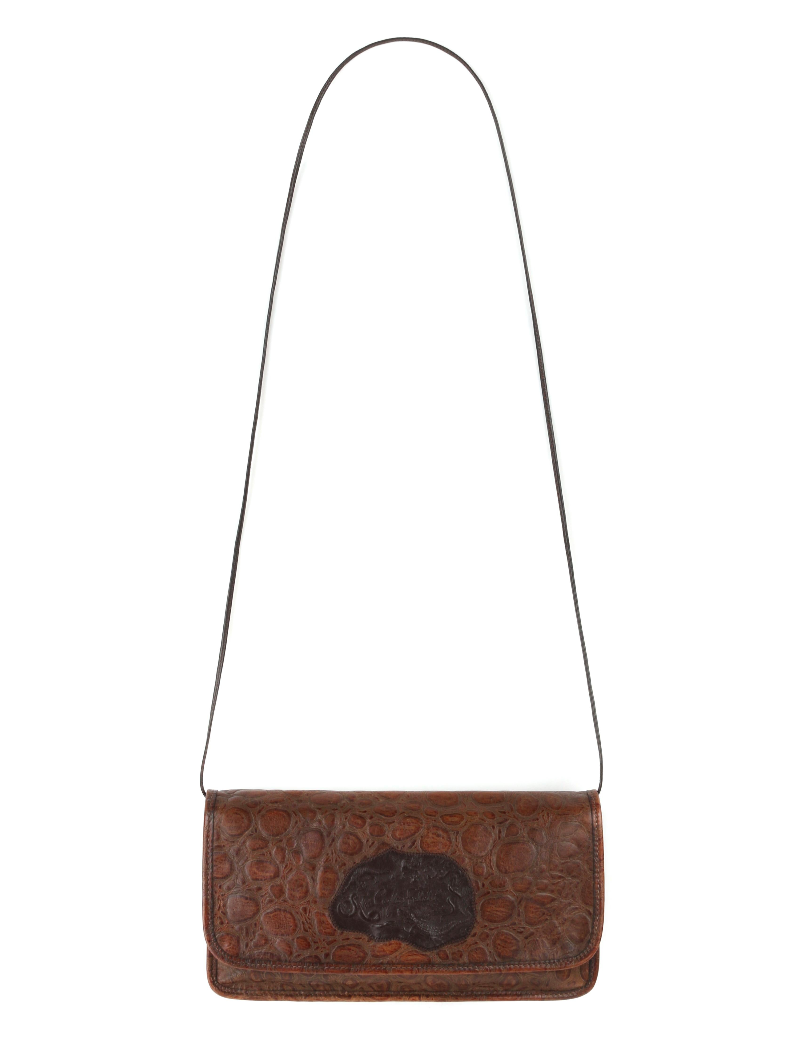 CARLOS FALCHI c.1990’s Brown Embossed Leather Patch Detail Flap Shoulder Bag 
 
Circa: 1990’s
Style: Flap shoulder bag
Color(s): Shades of brown
Lined: Yes
Unmarked Fabric Content (feel of): Leather (shell/interior); metal (closures)
Additional