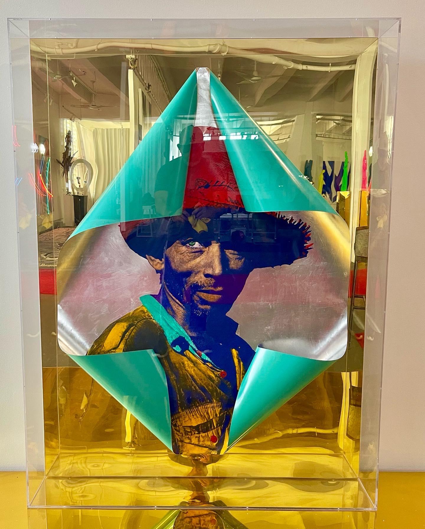 Mixed Media Photography , hand painted C-Print mounted on a gold acrylic mirror enclosed on a Plexiglass box


In this new series Mercado big format as a medium to intervene Jack Delano's photographs of Puerto Rican agriculture workers he documented