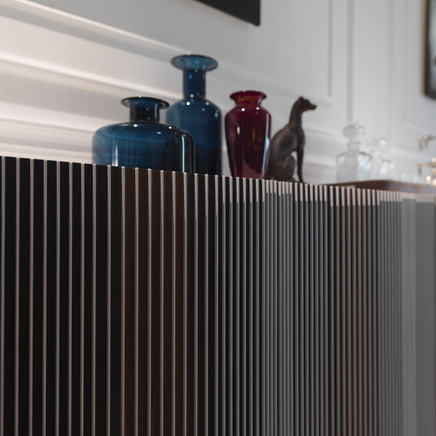 Exquisitely designed by Renato Zamberlan, who took inspiration from the work of Venezuelan artist Carlos Cruz-Diez, this four-door sideboard combines functionality and elegance in a refined silhouette. Made of thermo-treated oak with veneered MDF