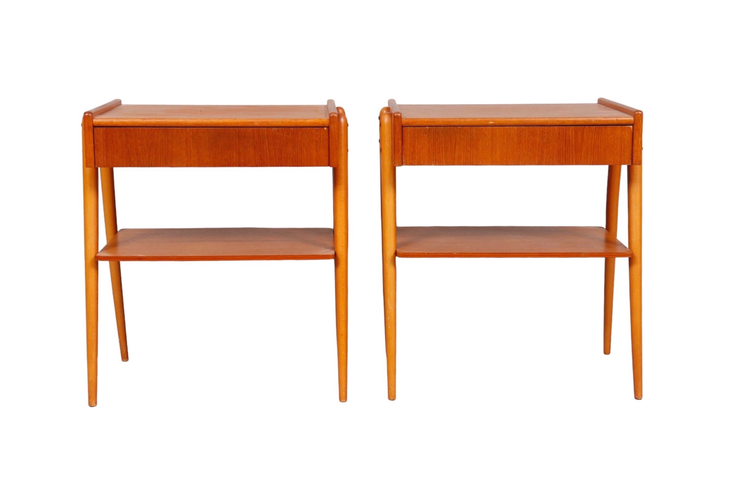 Pair of Mid-Century Modern nightstands by Carlström & Co Möbelfabrik. Made of beechwood with a single dovetailed drawer above a teak shelf.