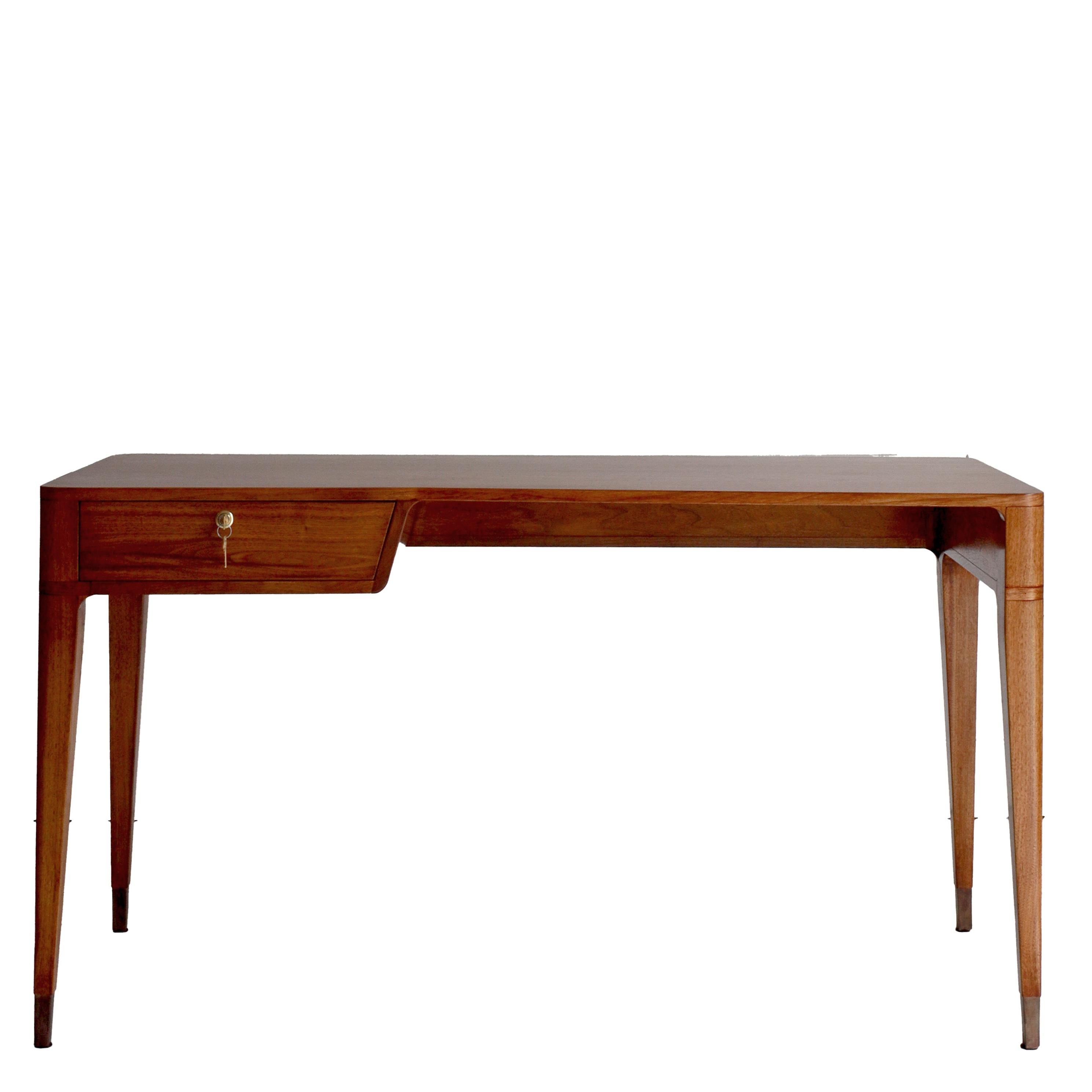 Part of The Modernist Collection, inspired by the work of Italian architect and designer Gio Ponti, this desk denotes a streamlined and indeed squarely modernist design.

Handcrafted in Italy from solid Canaletto walnut wood and finished with aged