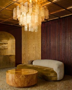 CARLTON II - unique round poplar burr veneered coffee table finished in high glo