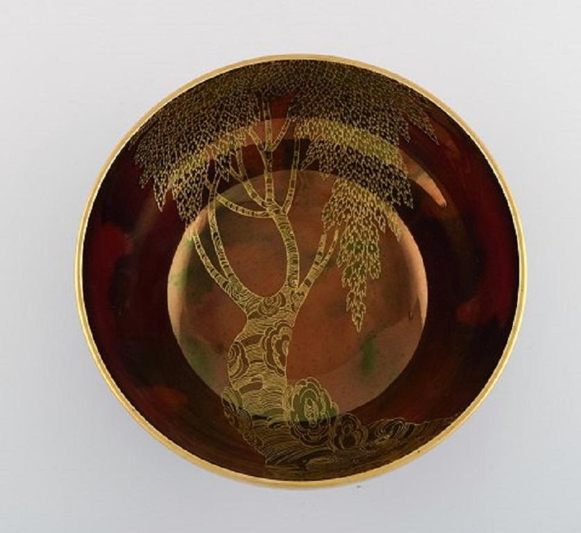 Carlton Ware, England. Bowl in hand-painted porcelain with trees and gold decoration,
Japanism, 1940s / 50s.
Measures: 20.5 x 10 cm.
In excellent condition.
Stamped.