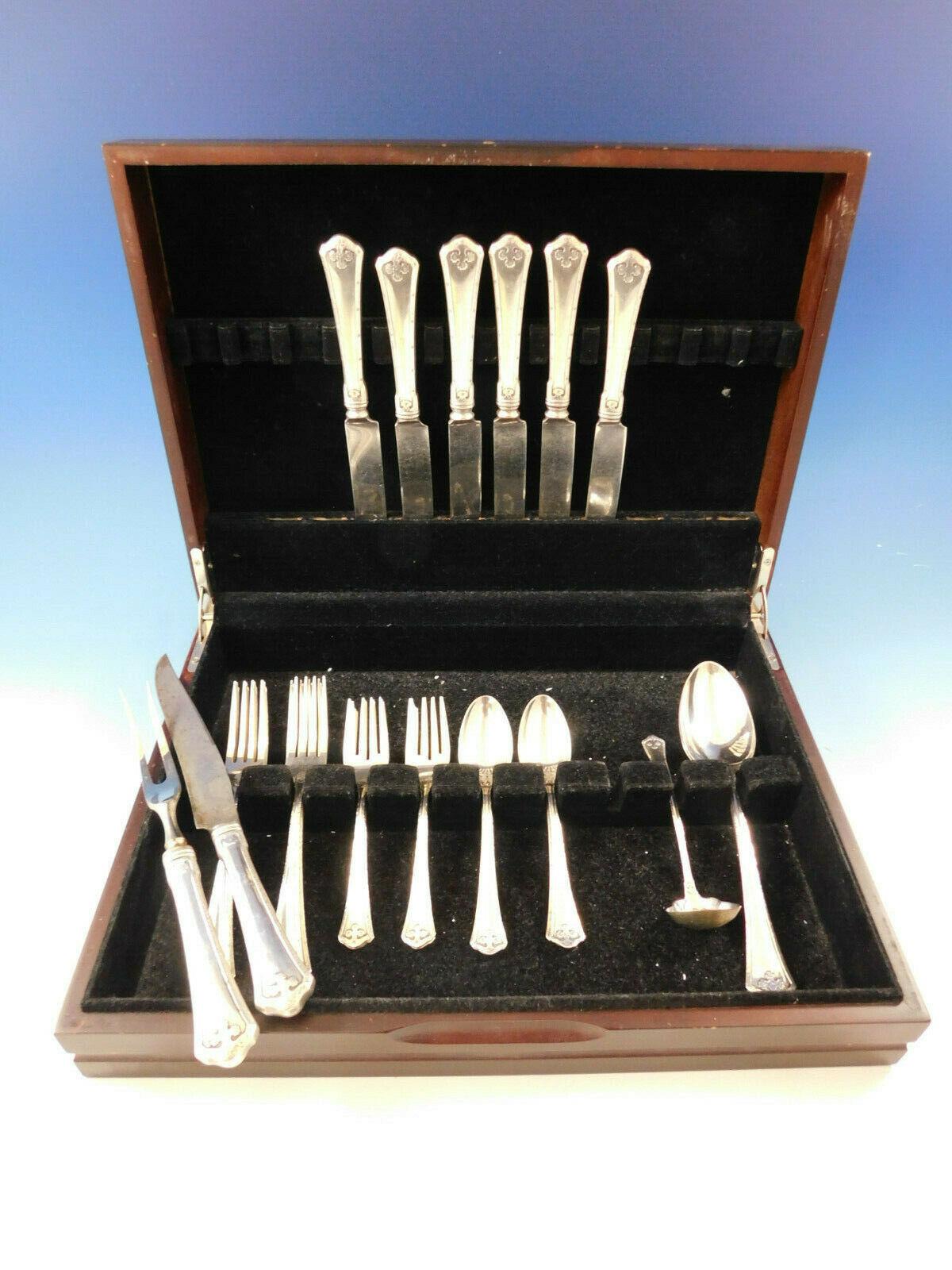 Carmel by Wallace sterling silver dinner size flatware set - 38 pieces. Great starter set! This Arts & Crafts pattern was introduced in the year 1912 and features a raised hammered border with stylized bolts. This set includes:

6 dinner size