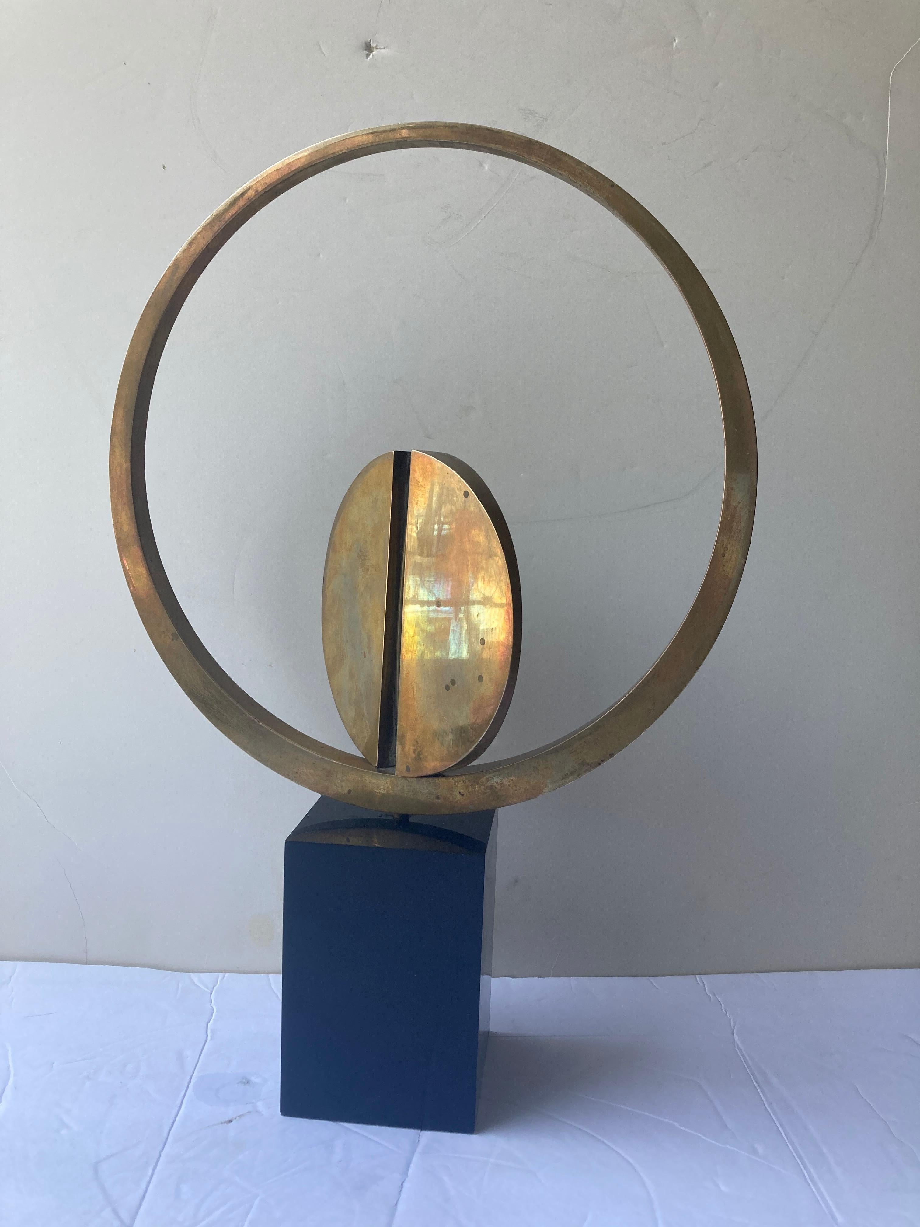 Traditional style sculpture for the well known Italian artist Carmelo Cappello. This is signed and dated 37/99 and 1978. The work shows patina of age and the work seats lose on the base. As kinetic.