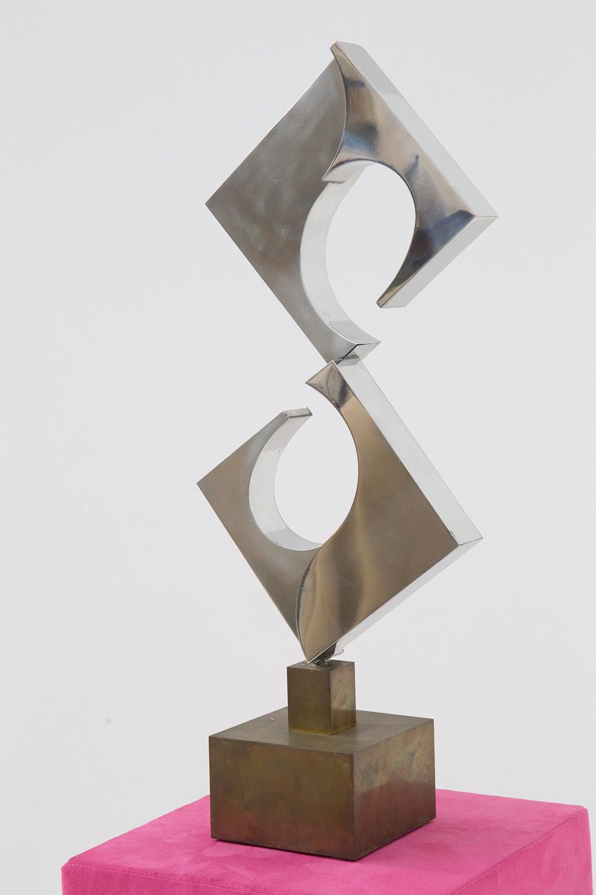 Futurist sculpture by master sculptor Cappello Carmelo entitled Triangular Spiral. Edition 5 of 6 of 1978, signature and year engraved underneath the sculpture. The work is a futurist depiction of architectural sculpture. The forms are vibrant and