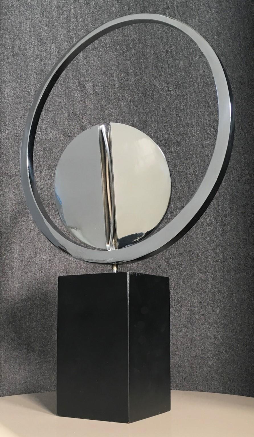 This is an artwork created by the well known Italian artist Carmelo Cappello. It is a multiple, an  Abstract Sculpture one of the identical 99 specimen edited in 1978. This piece is numbered 90/99. 

This Carmelo Cappello Abstract Sculpture is a