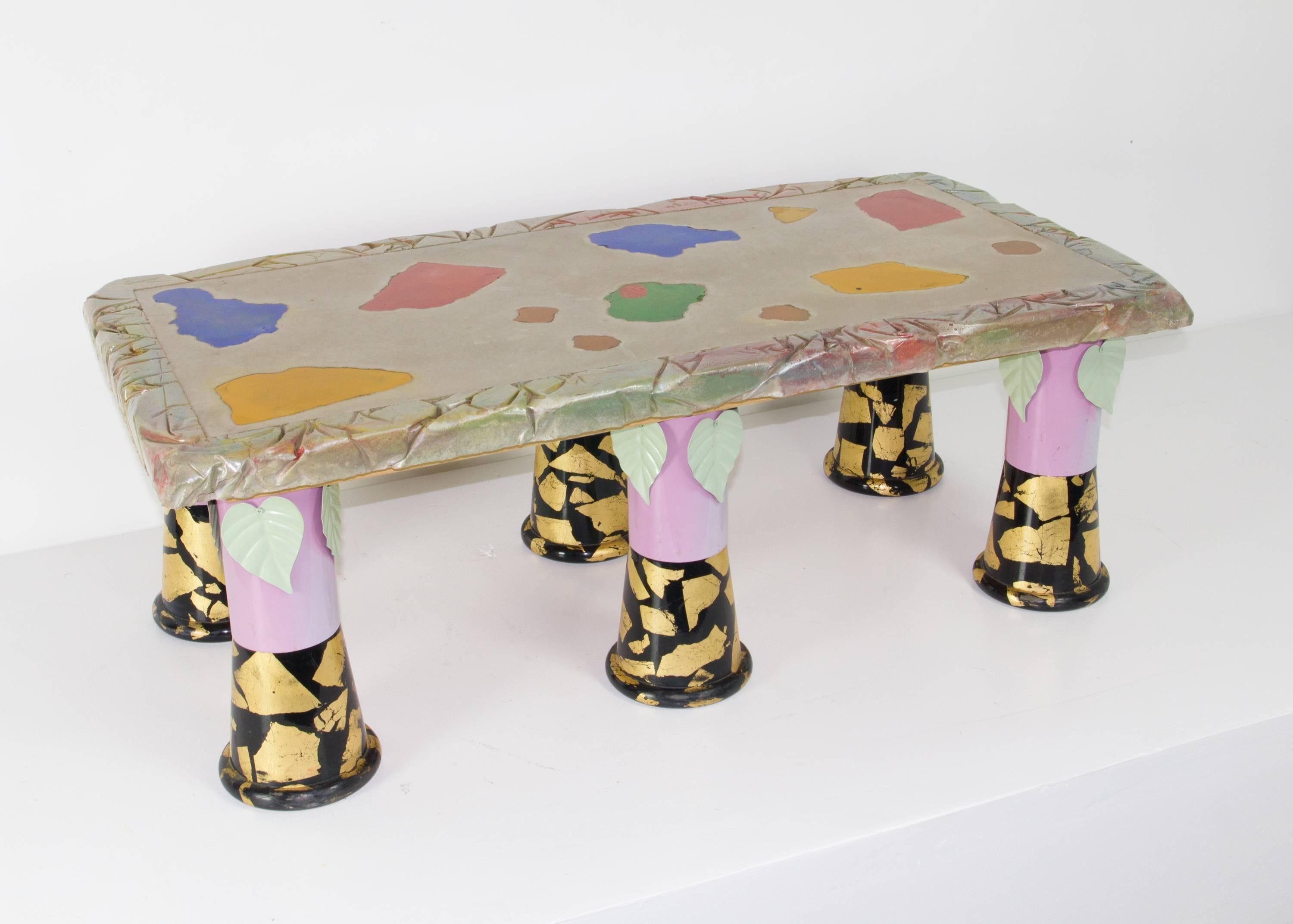 New to market, and previously unseen table by Carmen Spera, an important figure in the Downtown NYC art furniture scene as fostered by Art et Industrie. It features six painted and adorned metal legs supporting a substantial multi-textured cement