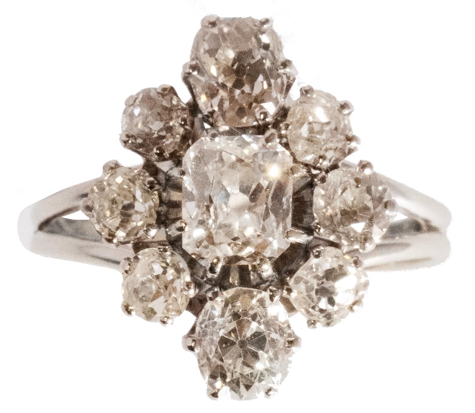 This exquisite statement piece features a 0.75 ct F/VS old cut diamond at its center. Accompanying it are two oval old cut diamonds totaling 1.10ct H/VS and six additional oval old cut diamonds, totaling 1.10ct H-K/SI.

Dating back to the 1960s in