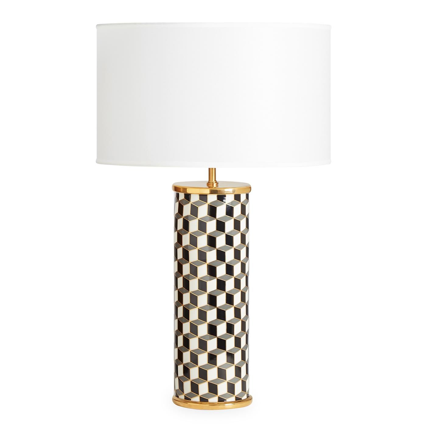 Graphic Pop. A classic cubes pattern in black and grey with gold accents for a spot of sparkle. Our porcelain and polished brass Carnaby Lamp combines a dash of downtown with a touch of uptown élan. A graphic addition to any tabletop, its large