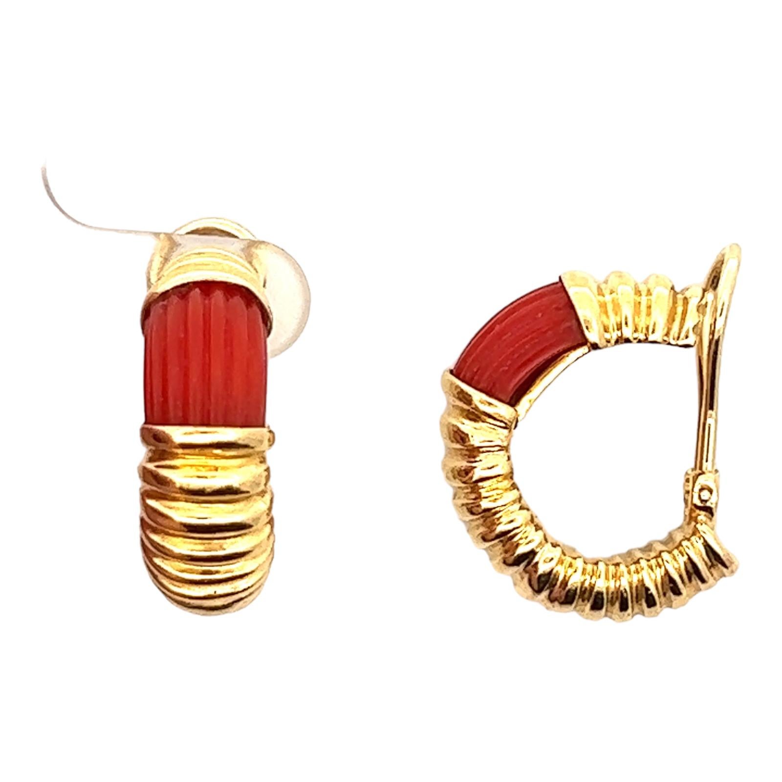 Vintage carnelian gemstone half hoop earrings are fashioned in 18 karat yellow gold. The earrings feature ribbed carnelian gemstone and ribbed gold. The earrings measure 24 mm in length and 8mm in width. Lever-back clip backs (posts can be added). 