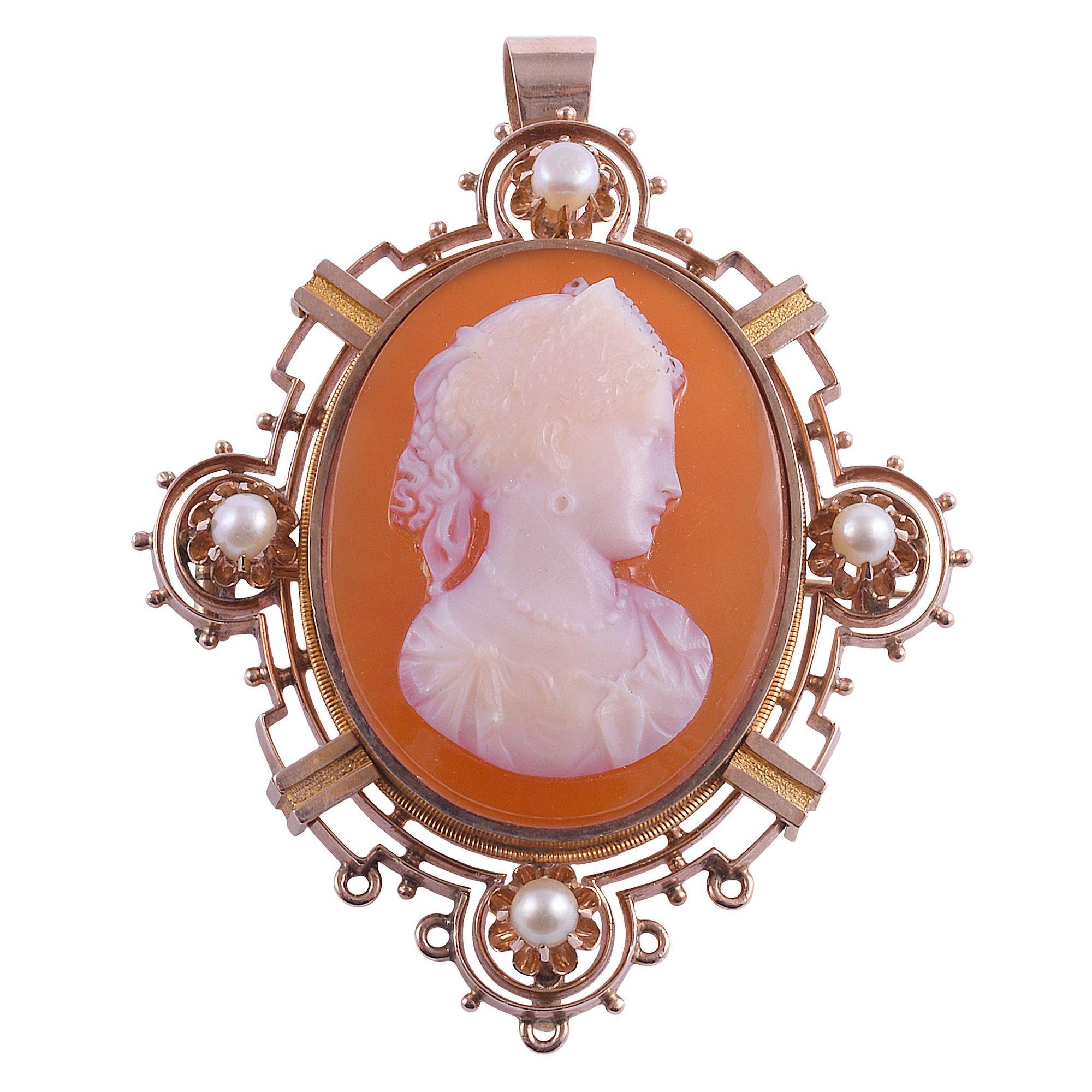 Antique Victorian carnelian & agate cameo pin or pendant, circa 1880. This antique cameo is very finely carved in agate and carnelian. The hardstone cameo is set in a 14 karat yellow gold frame with a pin back and a fold down bail. This Victorian