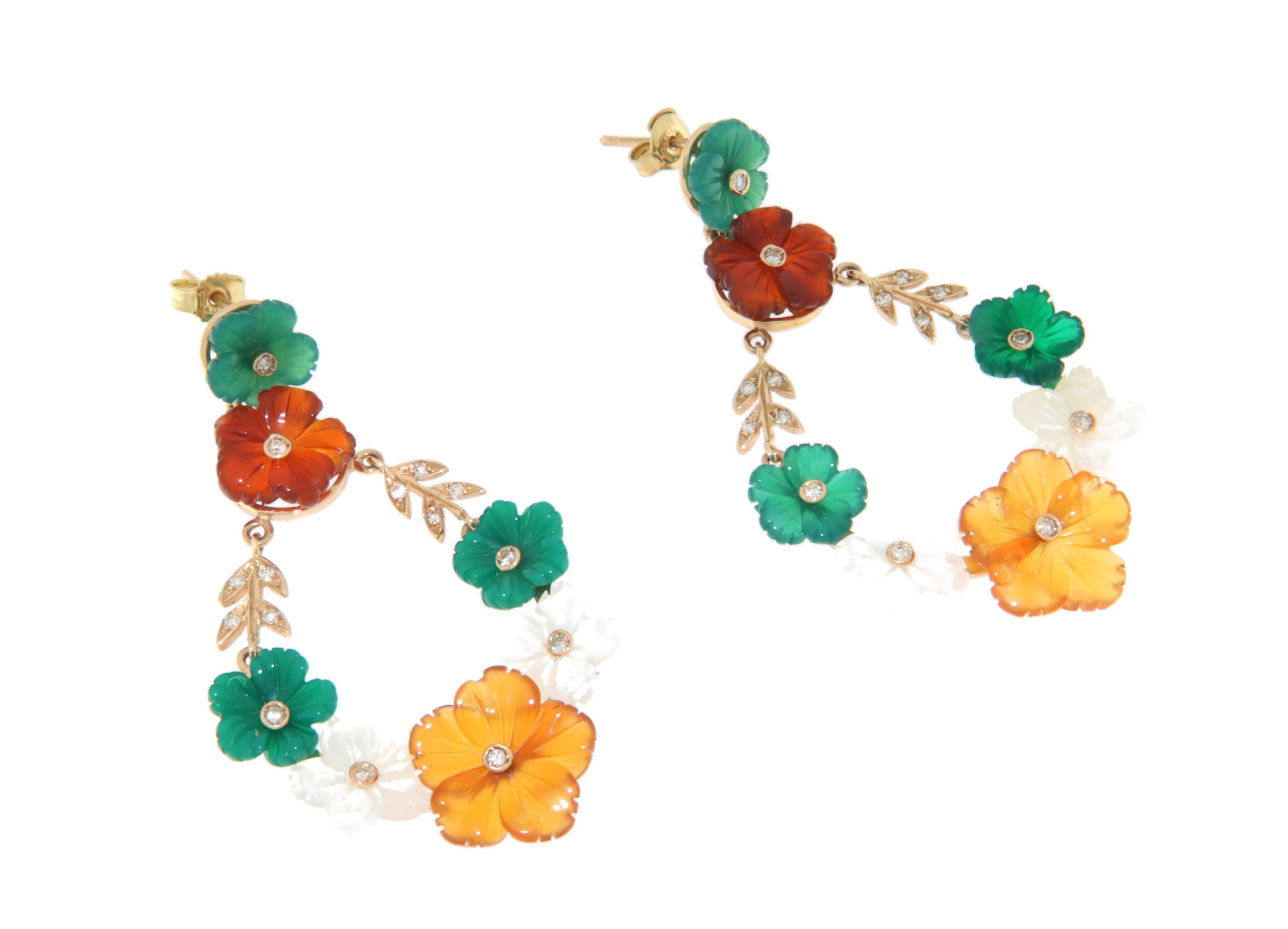 These enchanting earrings are a perfect harmony of nature-inspired elegance and refined craftsmanship, crafted in 14k yellow gold. Each earring is adorned with an exquisite arrangement of colorful, hand-carved floral elements, featuring a stunning