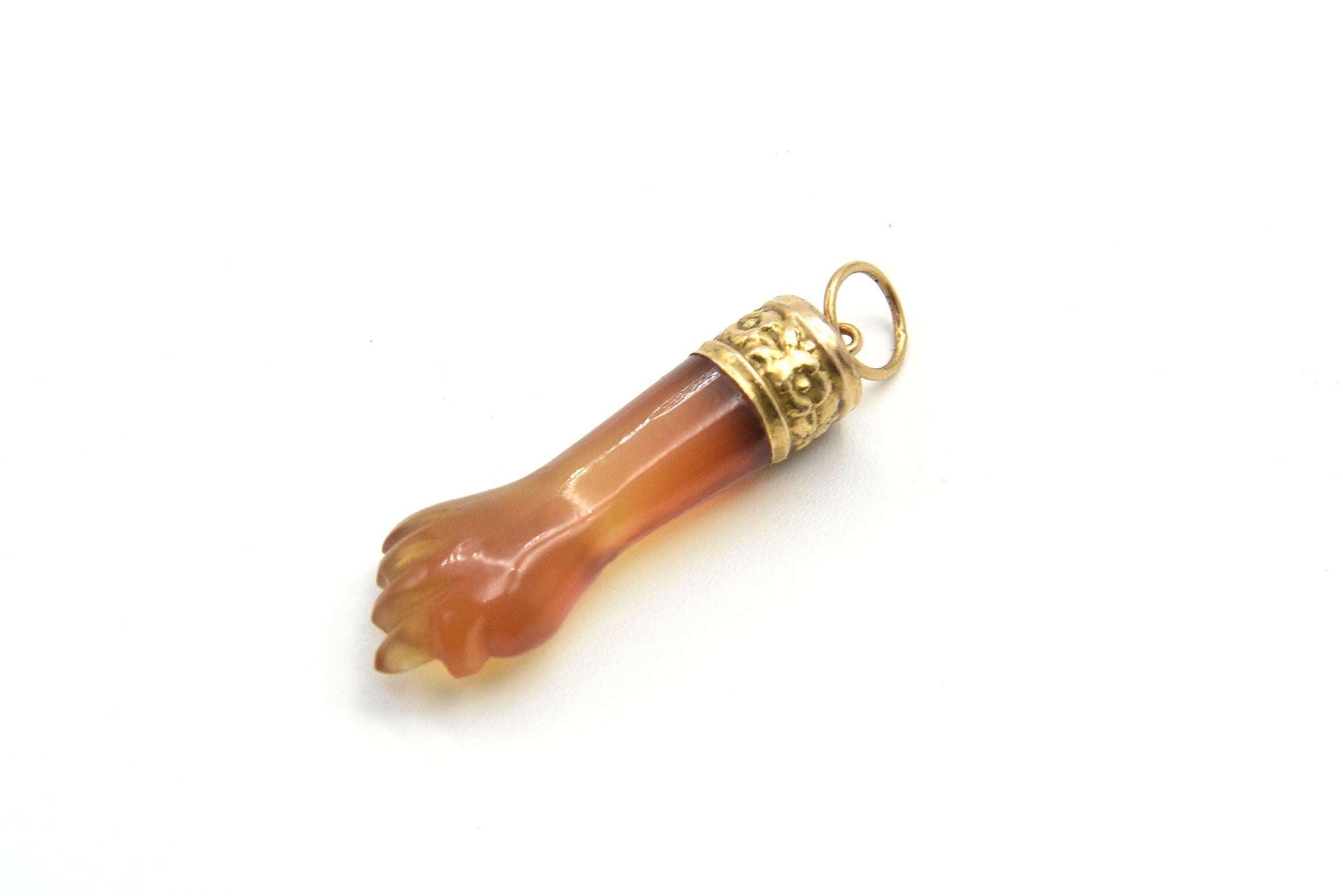 Vintage carnelian agate figa hand charm hanging from a beautiful 14k yellow gold floral cuff bracelet cap. Length with out the ring is 1.61