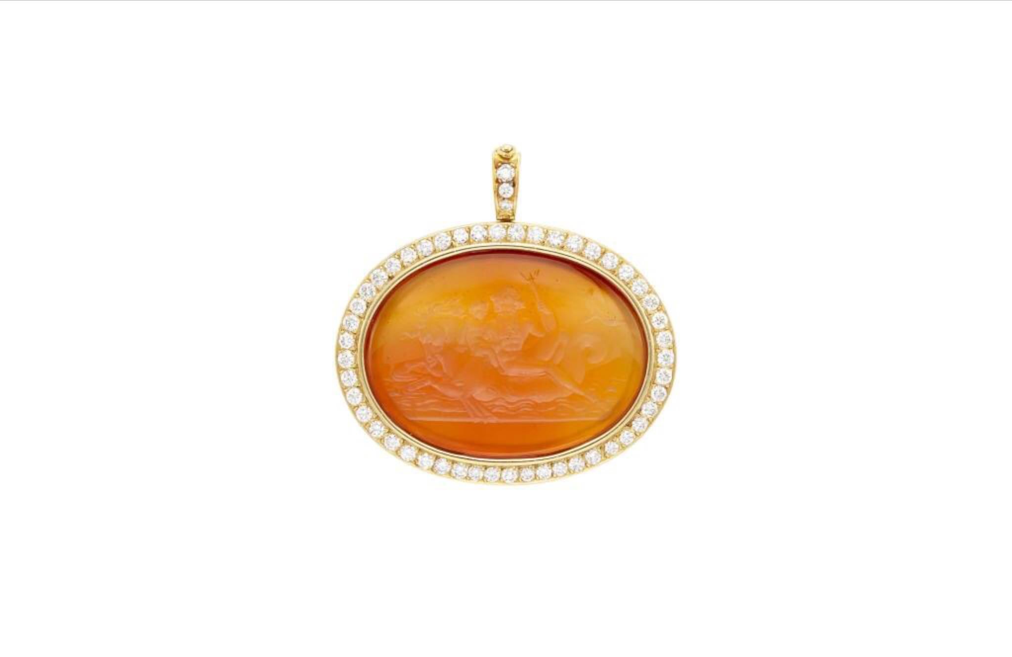 Intaglio pendant-brooch in 18kt yellow gold with one oval carved carnelian (app. 30.0 x 40.0 mm) and 51 round diamonds (app. 2.15 cts., app. 12.5 dwts. gross.)