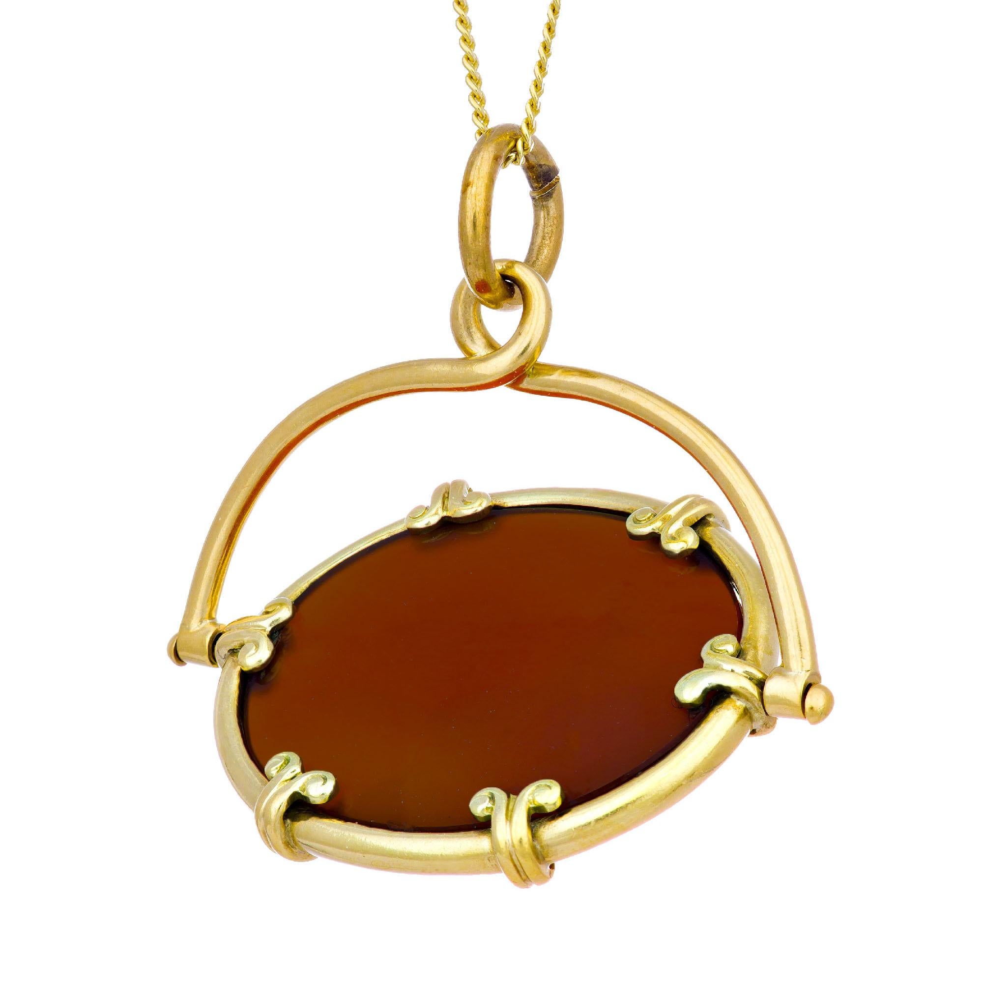 Early 1900's carnelian 14k yellow gold watch fob pendant necklace. Oval center carnelian in 14k yellow gold on an 16 inch chain. 

1 oval reddish orange cabochon carnelian 
14k yellow gold 
Stamped: 14k
9.0 grams
Top to bottom: 33.6mm or 1 1/3