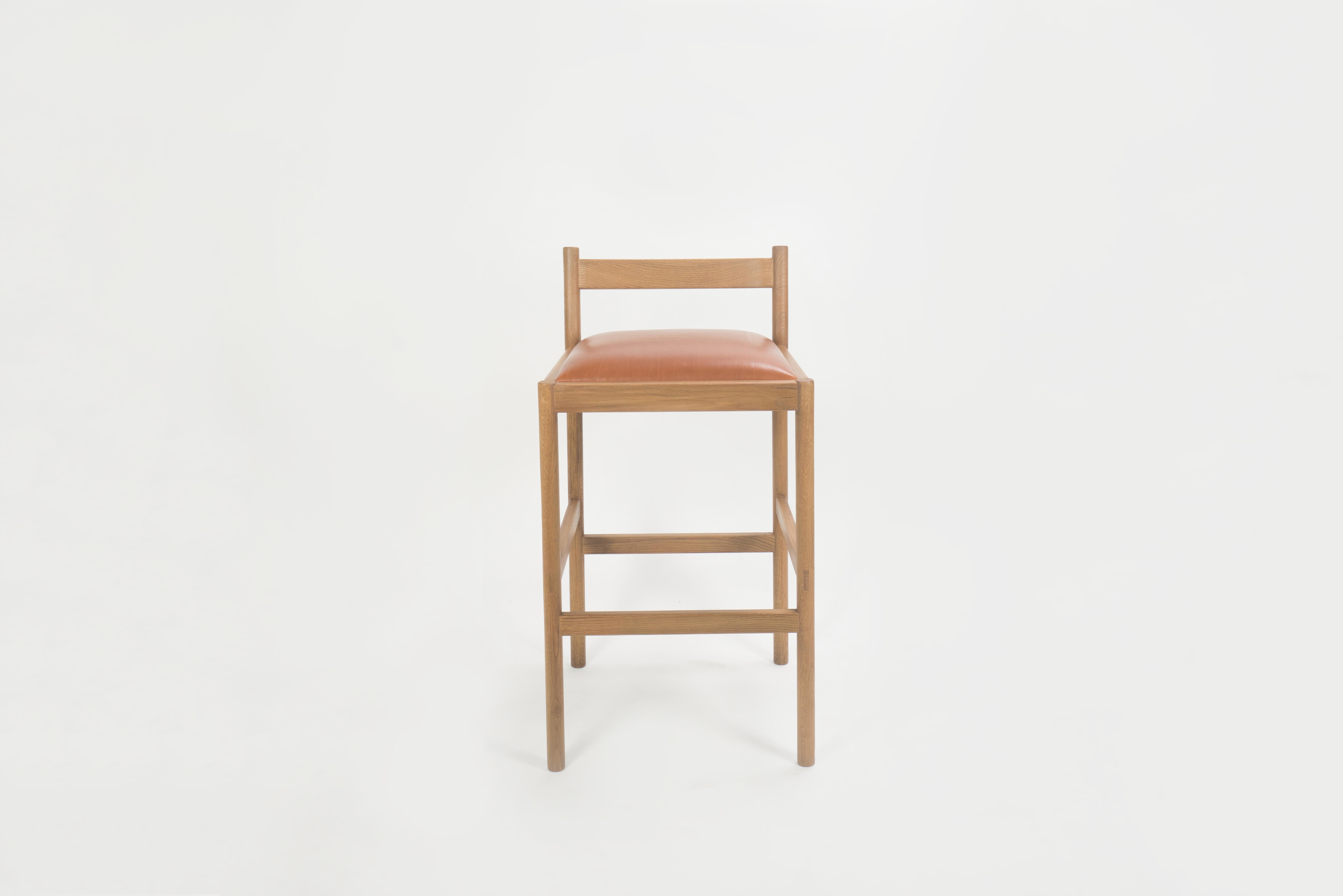 For the Carob Stool, we designed around what we like in a stool - a wide, cushioned, comfortable seat, a practical footrest, and an easily moveable form from all angles in a crowded space. The stool was designed around minimizing its horizontal