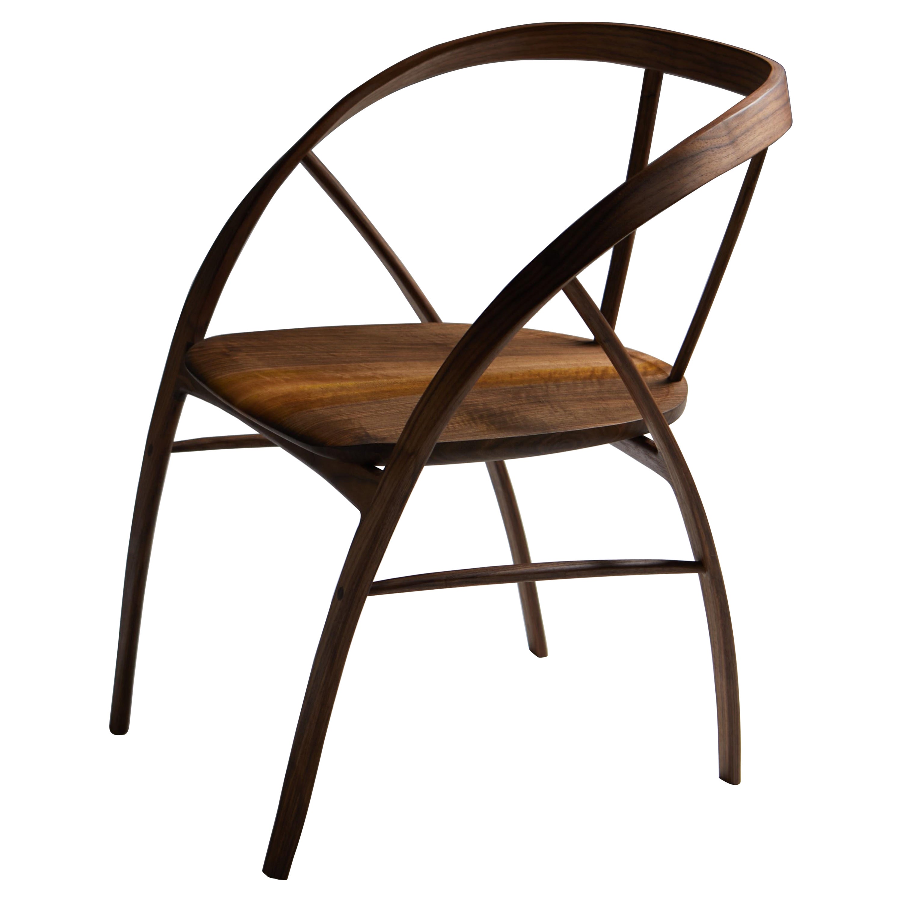 The Carol Dining Chair.

The Carol chair is handmade using bent walnut with the seat of book-matched English walnut. 
