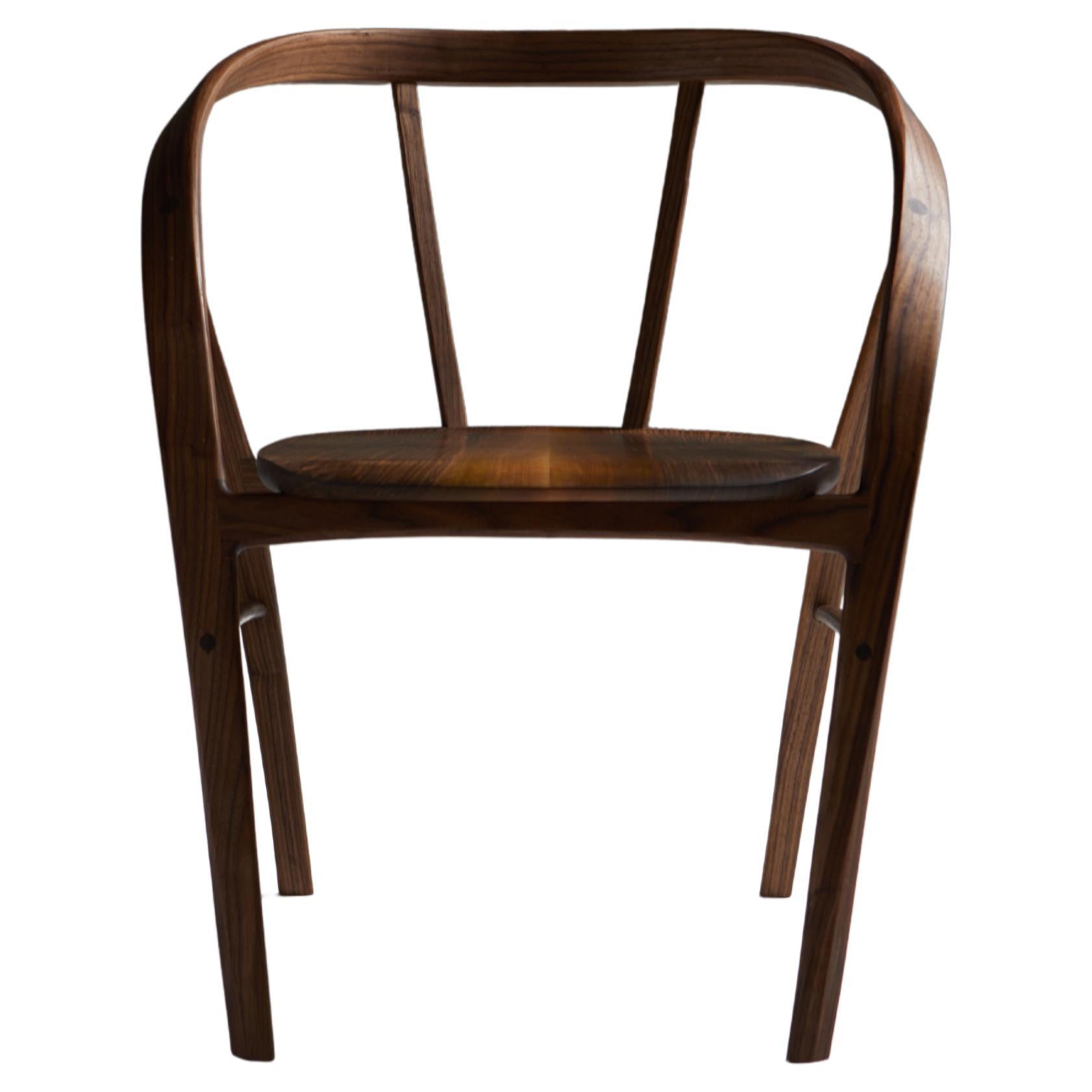 The Carol Dining Chair in Bent Wood with book-matched seat by Jonathan Field