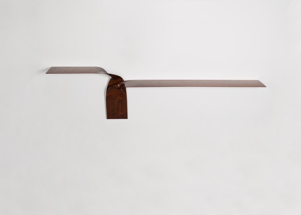 Hand-carved, wall-mounted shelf in walnut by Carol Egan.
Please note this item is made by order.