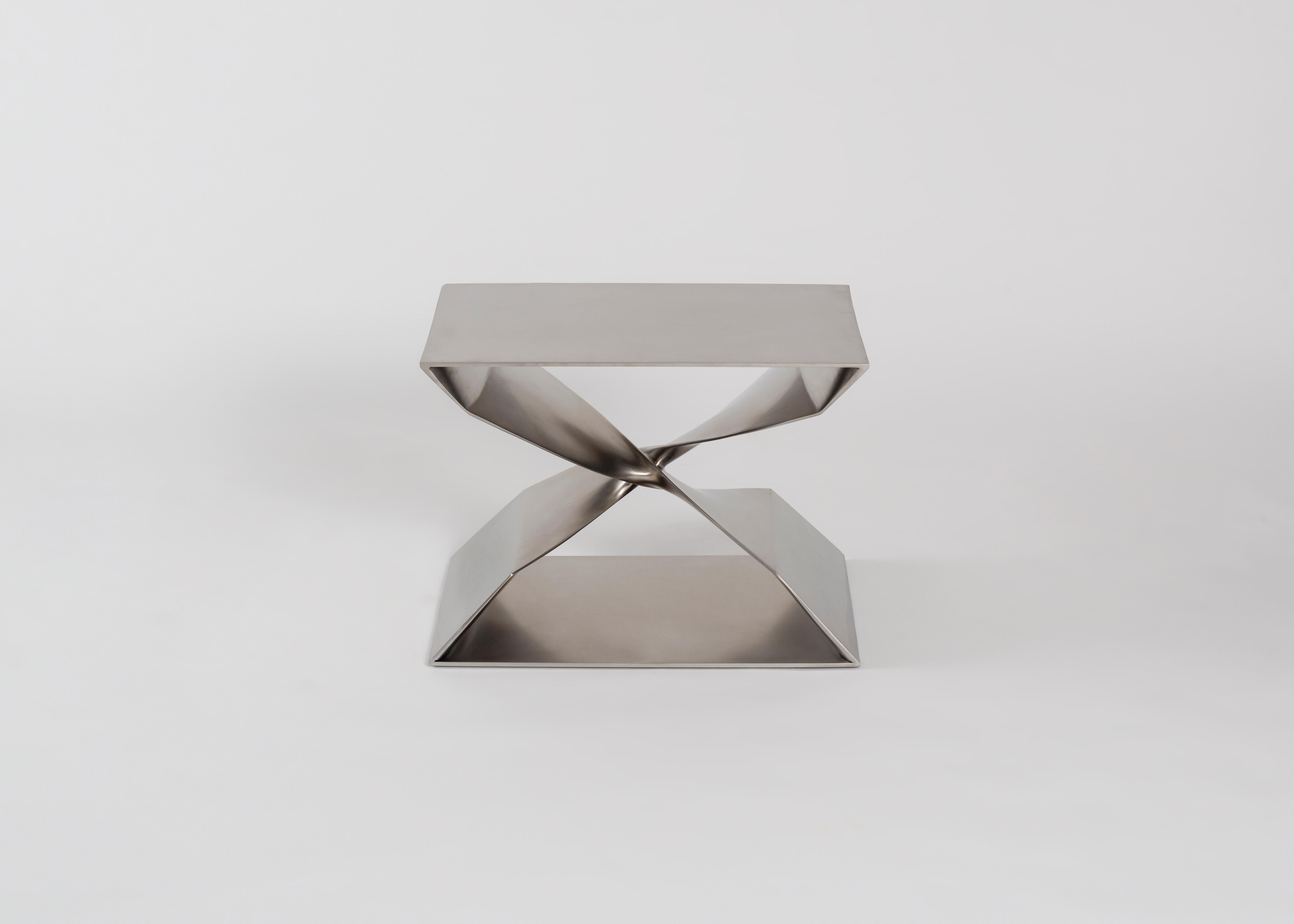 Sculptural brushed stainless steel stool by Carol Egan.

This sculptural stool is part of a line of contemporary furniture designed by blending digital technology with fine traditional craftsmanship. Cast in stainless steel, the stool features two