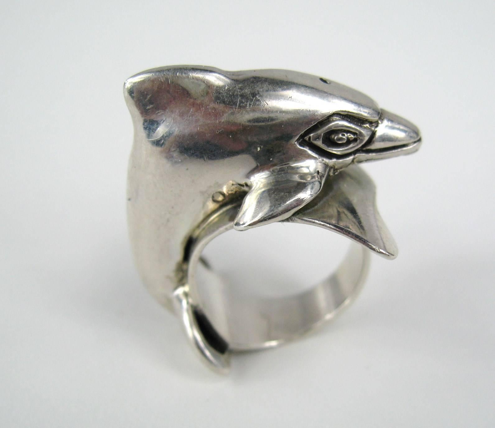 A Large Carol Felley Dolphin Ring in Sterling Silver. This is a Wide as well as a High Ring. Hallmarked and dated 1988 inside the shank of the ring measuring 1 inch top to bottom Ring and about .60in High.  size 7. This is out of a massive