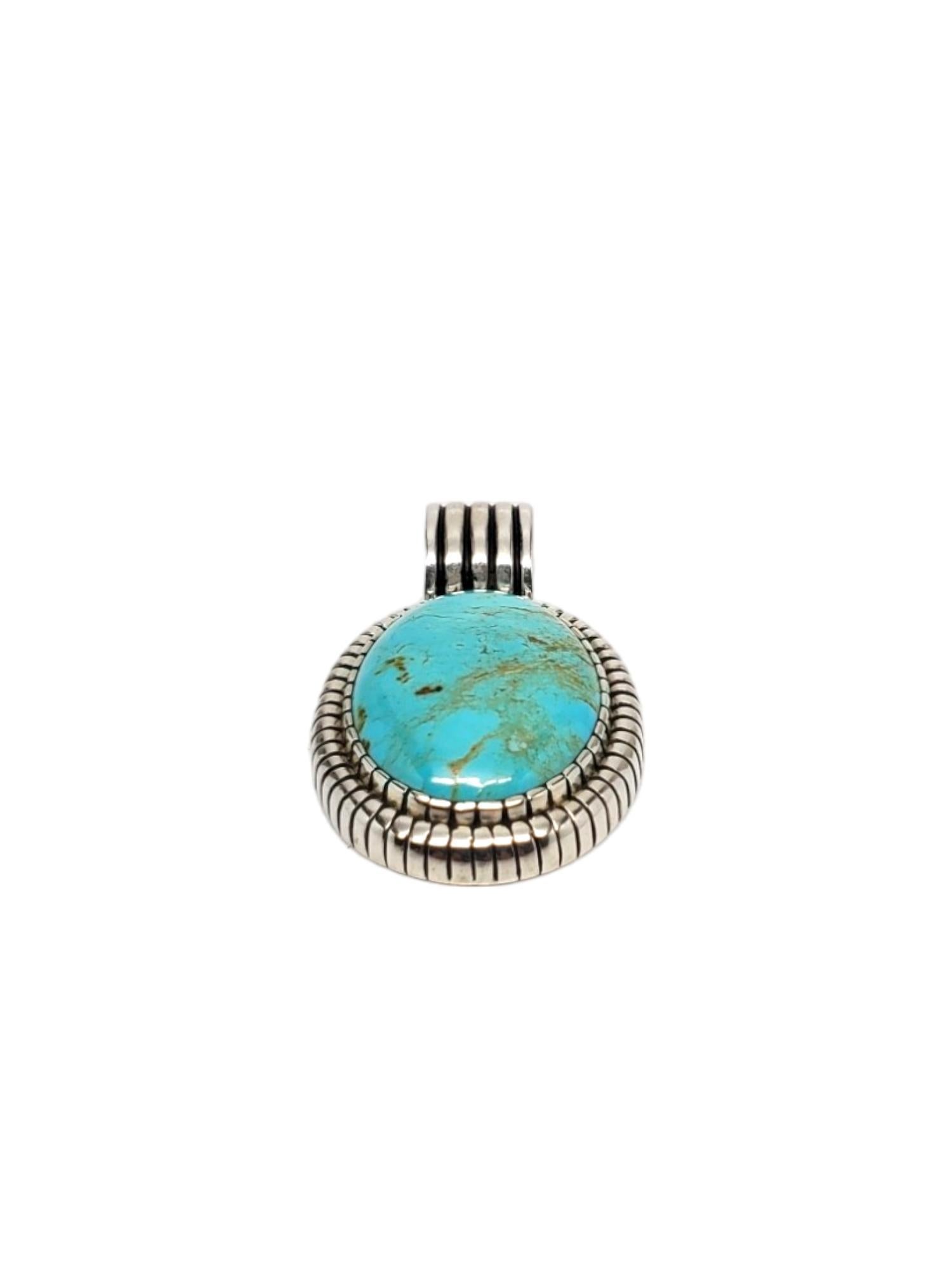 Carol Felley Sterling Silver Oval Turquoise Pendant-

This vintage Carol Felley pendant features a large oval turquoise stone ( 29.81mm x 21.85mm) set in beautiful sterling silver.

Size 2 in. x 1.17 in.

Stamped: CF STERLING 

Weight: 19.2 dwt./