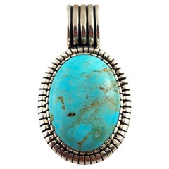 Colgante ovalado de turquesa de plata de ley Carol Felley #17172