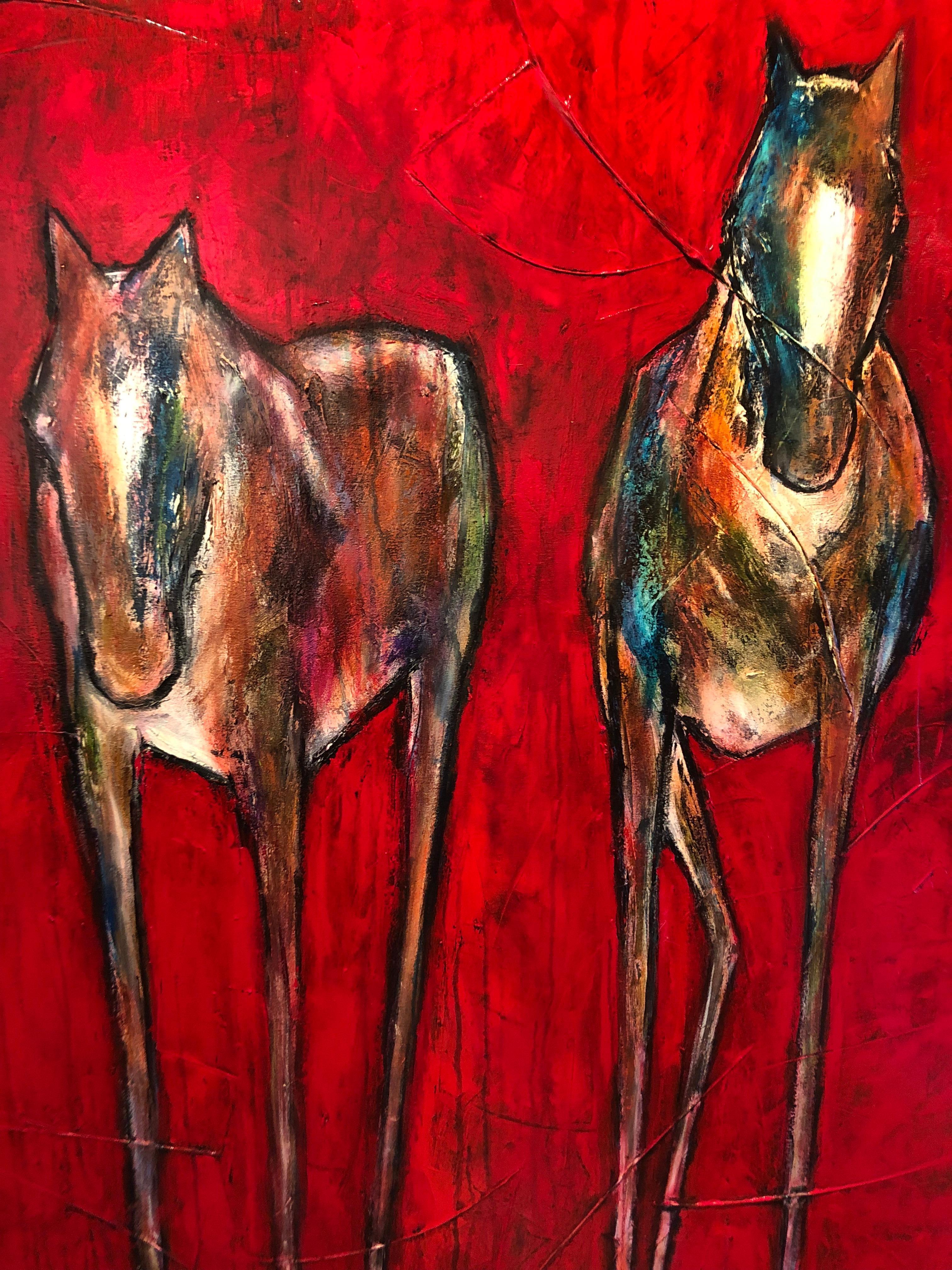 A large square acrylic painting of wild horses in striking red, brown, blue, and green by Carol Spielman. The work showcases Spielman's lifelong love of horses, as she captures their strong and wild nature through thick, textured strokes of paint