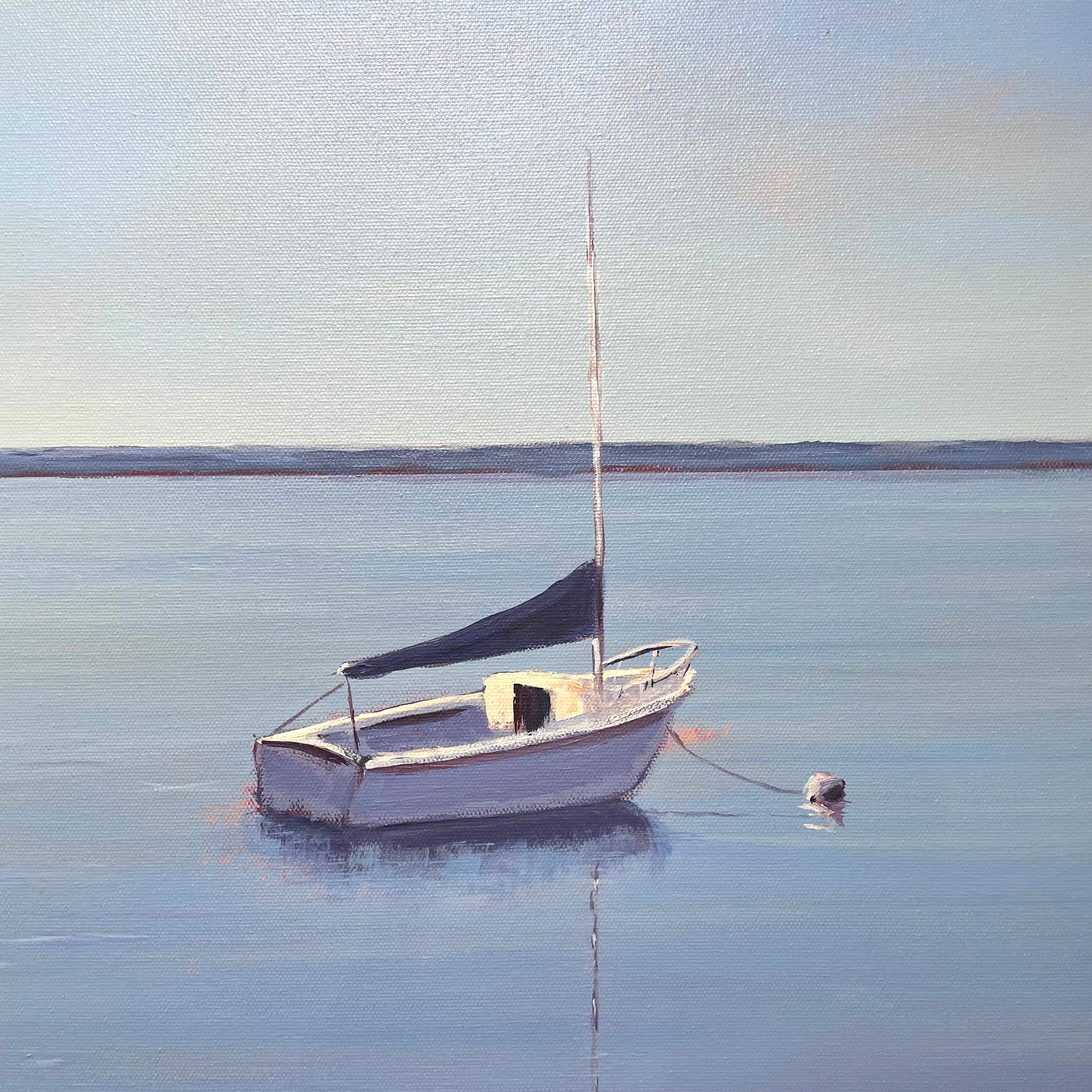 This contemporary coastal landscape painting by Carol Young is made with acrylic paint on canvas. It captures two small boats anchored in a bay on muted blue water which is mirrored by a clear blue sky. A thin strip of land is visible along the