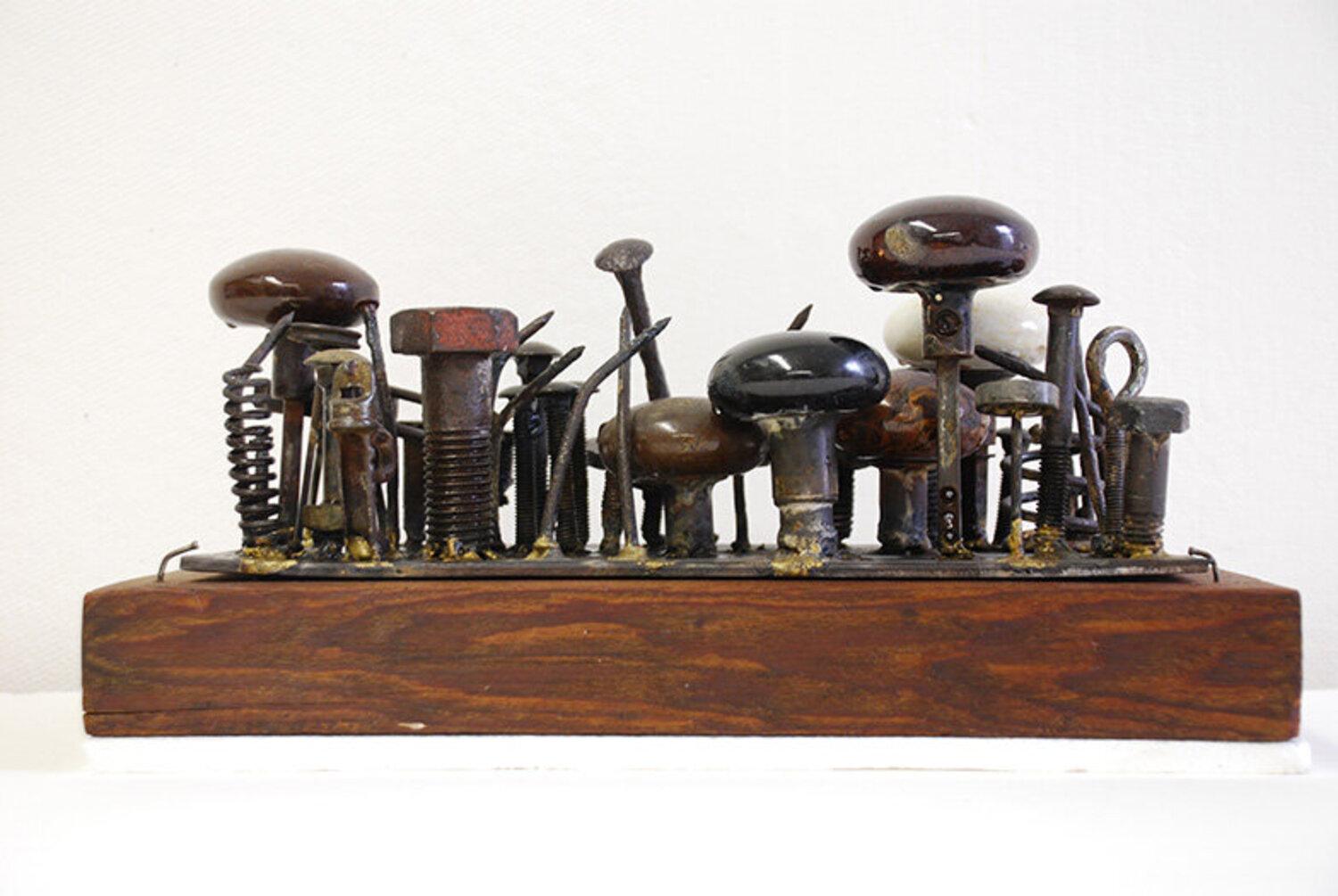 Carole Eisner Abstract Sculpture - Door-Knobs, scrap metal abstract sculpture