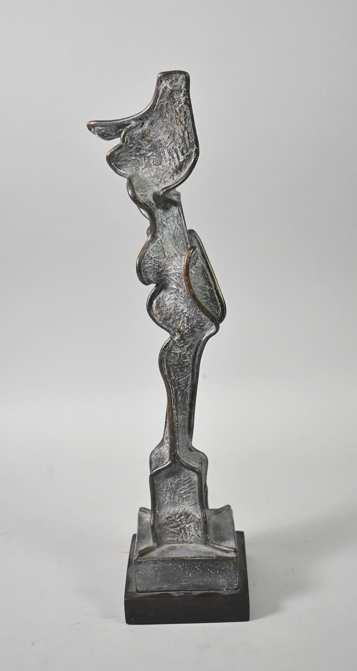 Abstract cast bronze sculpture signed by Carole Harrison. 12 1/4