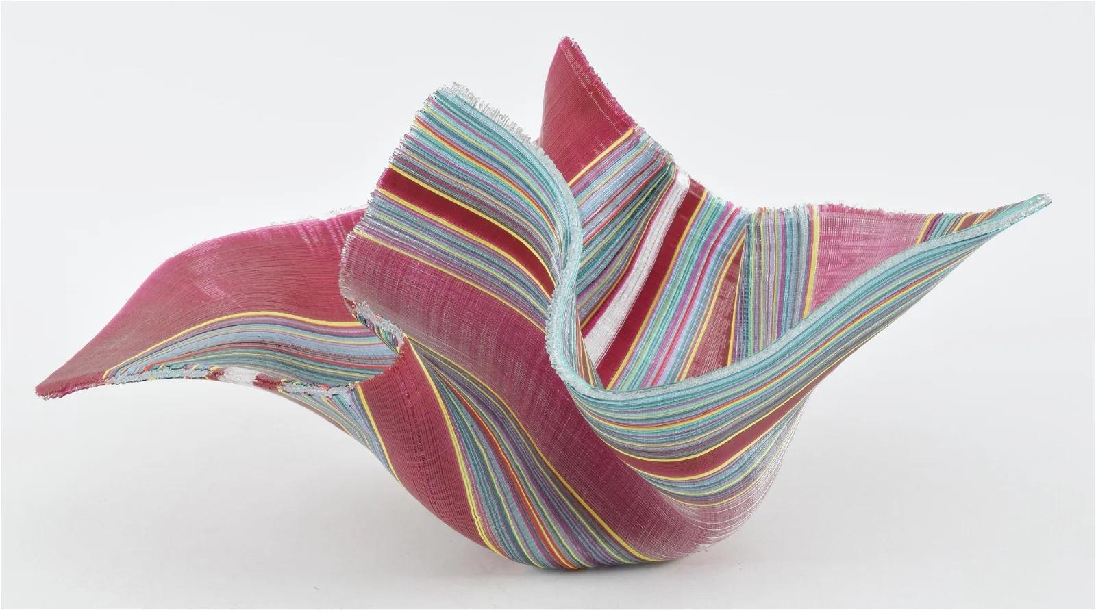 An American Studio Craft woven glass handkerchief sculptural form by, Carole Perry made up of thousands of woven individual glass threads of varying colors, woven and fused together. It is signed, 