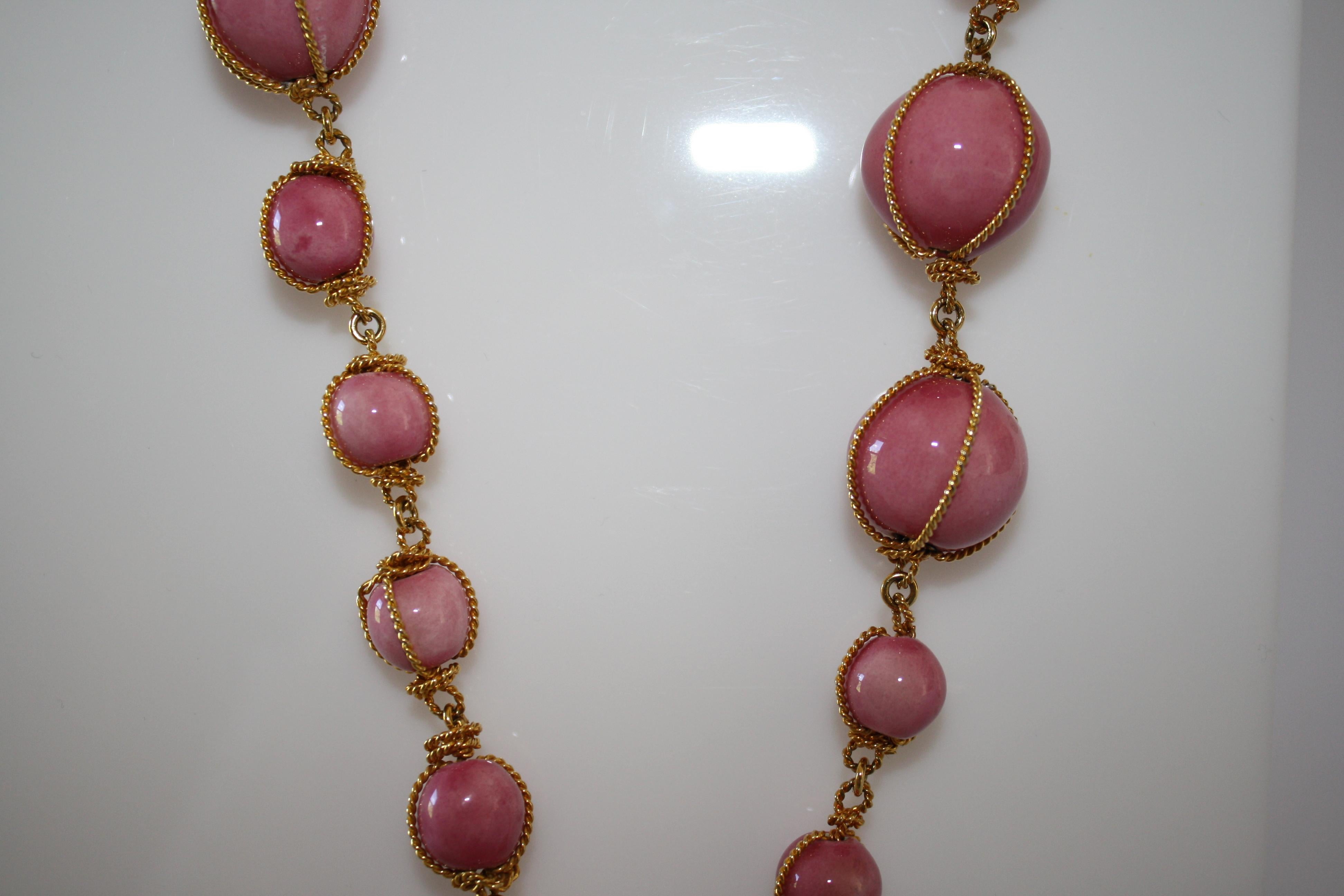 Carole Saint Germes ceramic bead necklace with gilded heart pendant. Pendant has pink pate de verre glass throughout. 