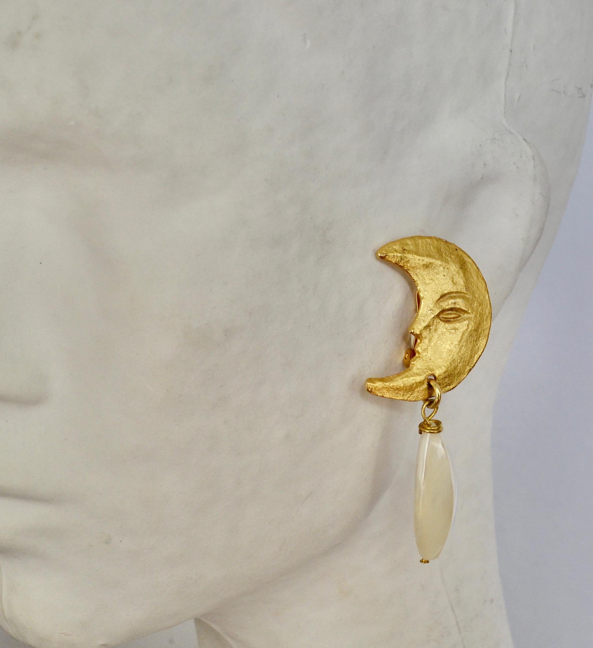 Half moon in 24-carat gold dipped metal with elongated mother of pearl drop by French designer Carole St Germes.