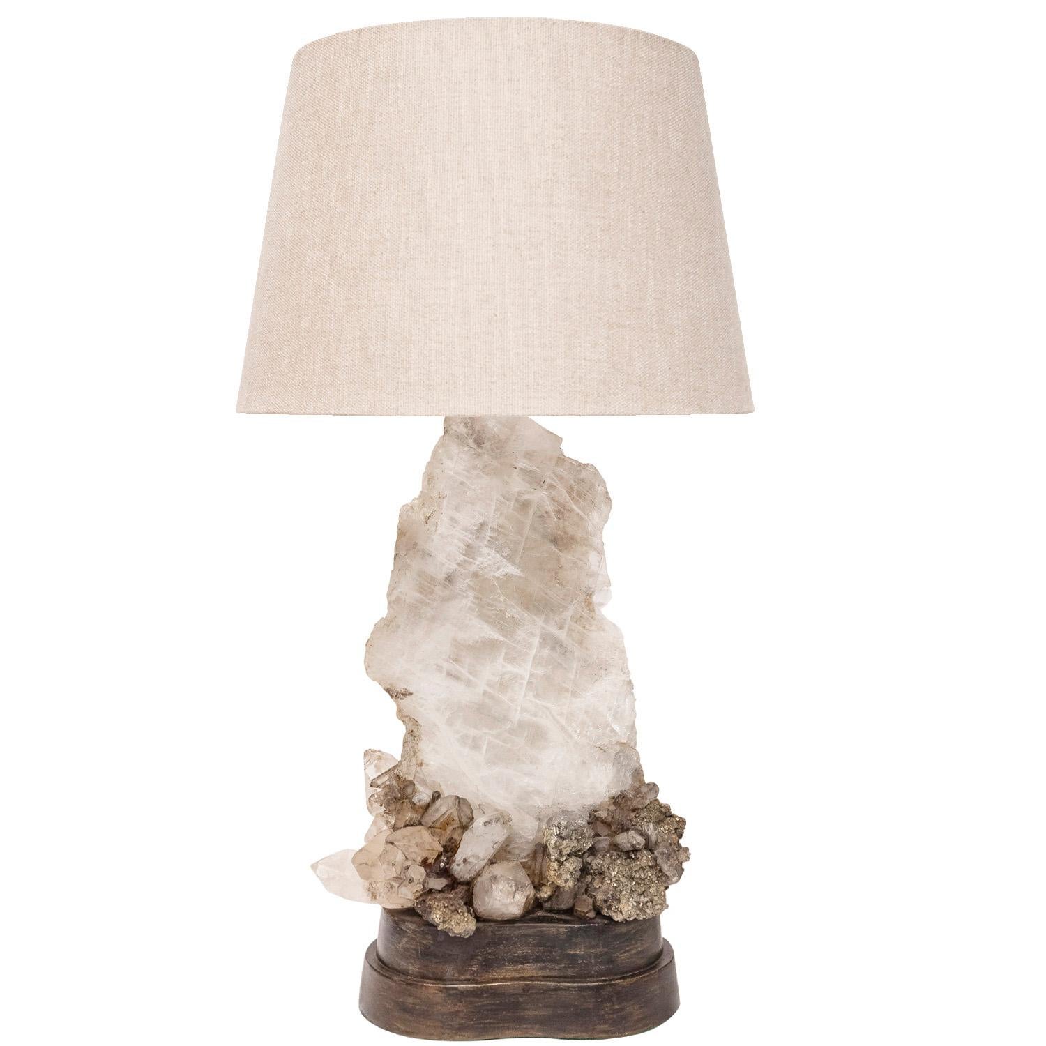 Large and exceptional studio made table lamp with a quartz slab and pyrite clusters with back illumination by Carole Stupell, American 1950's.  Everything about this lamp is exceptional:  the use of a quartz slab, the use of pyrite and the back