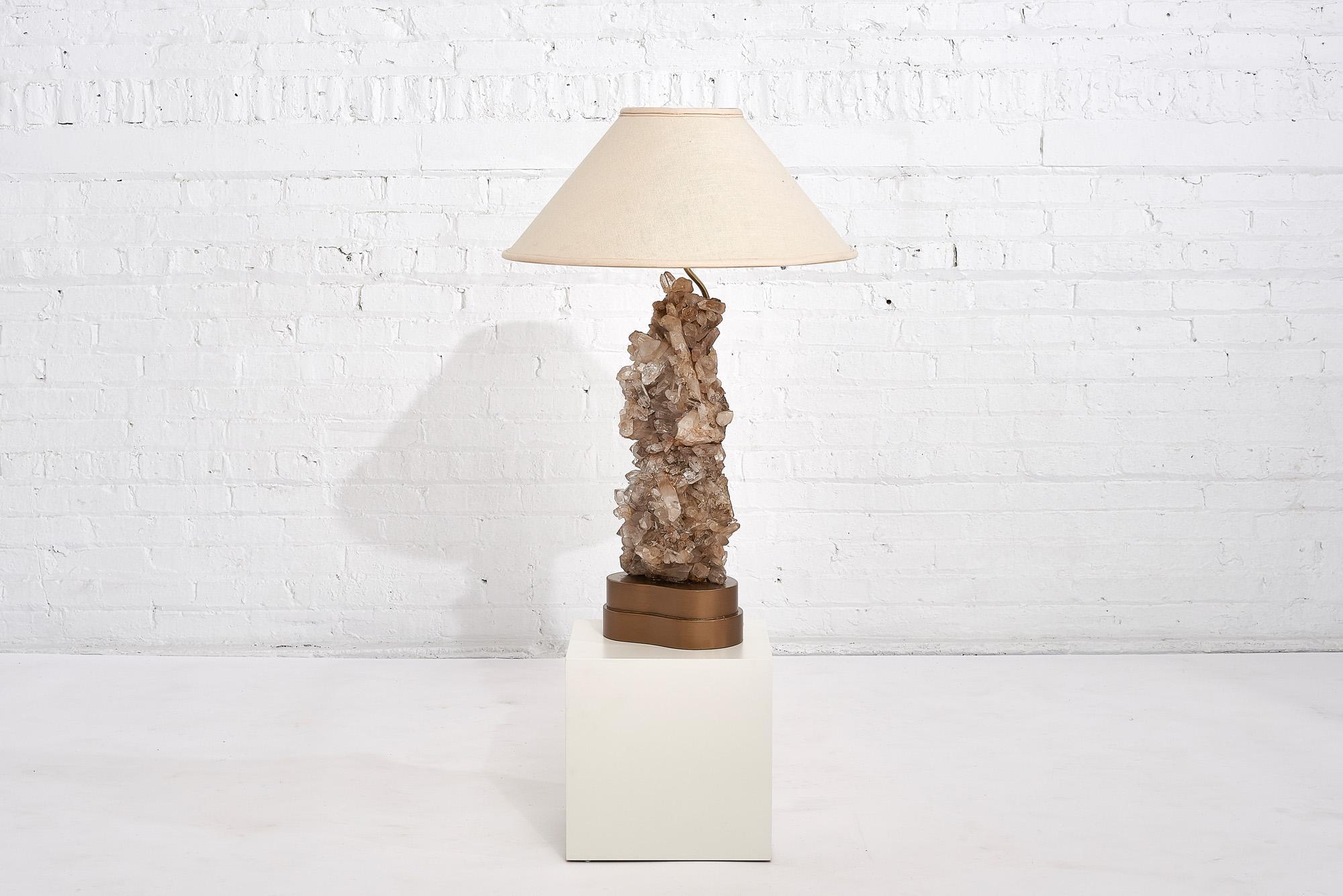 Carole Stupell quartz table lamp, circa 1950. Lamp is mounted on a gold gilded wood base.