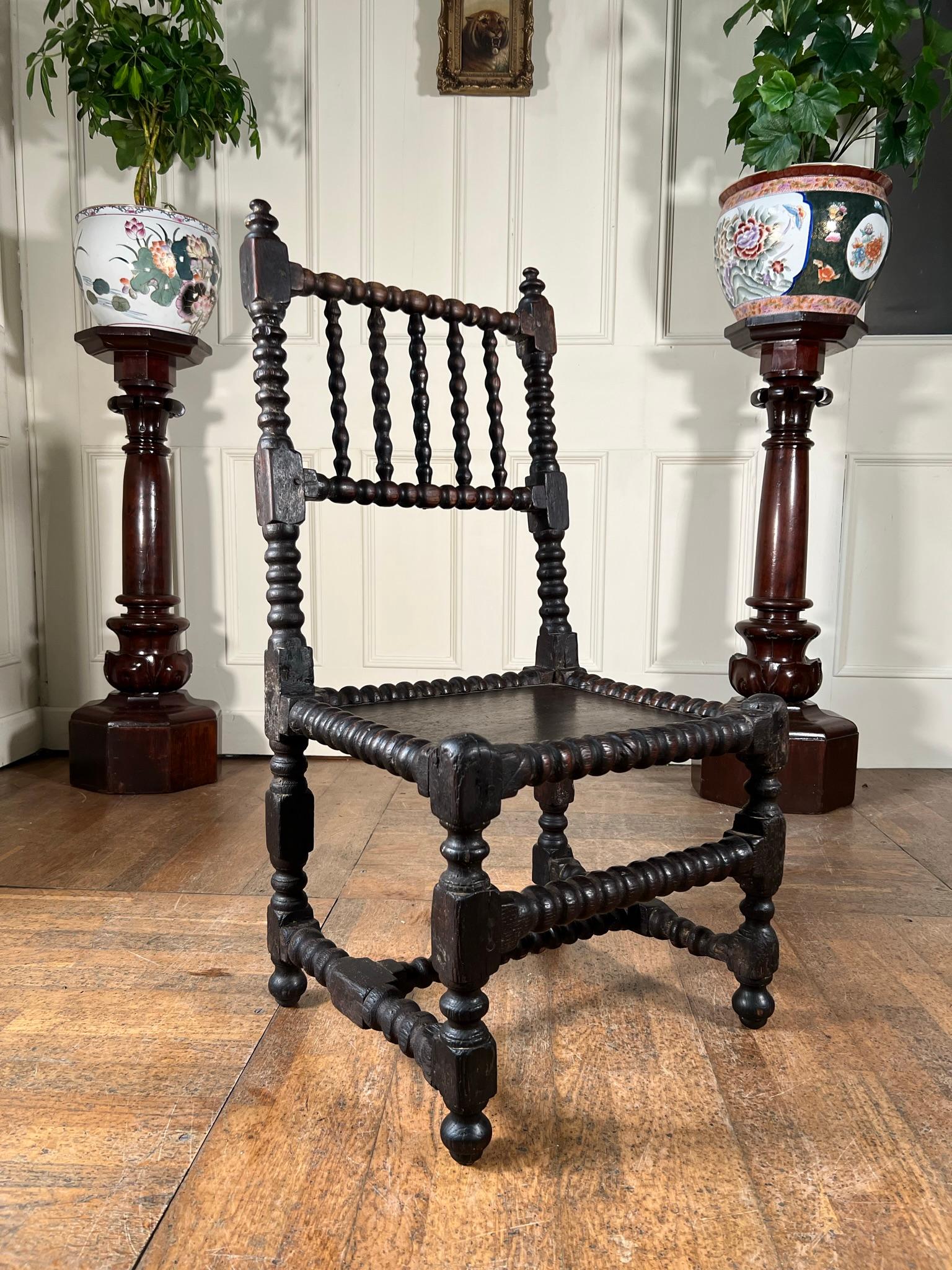Rare surviving walnut turned joined bobbin backstool chair in original condition with fantastic wear.

Plank seat dated verso 1684.

Measurements: 95cm h x 46cm w x 40 cm d (37cm h seat height)