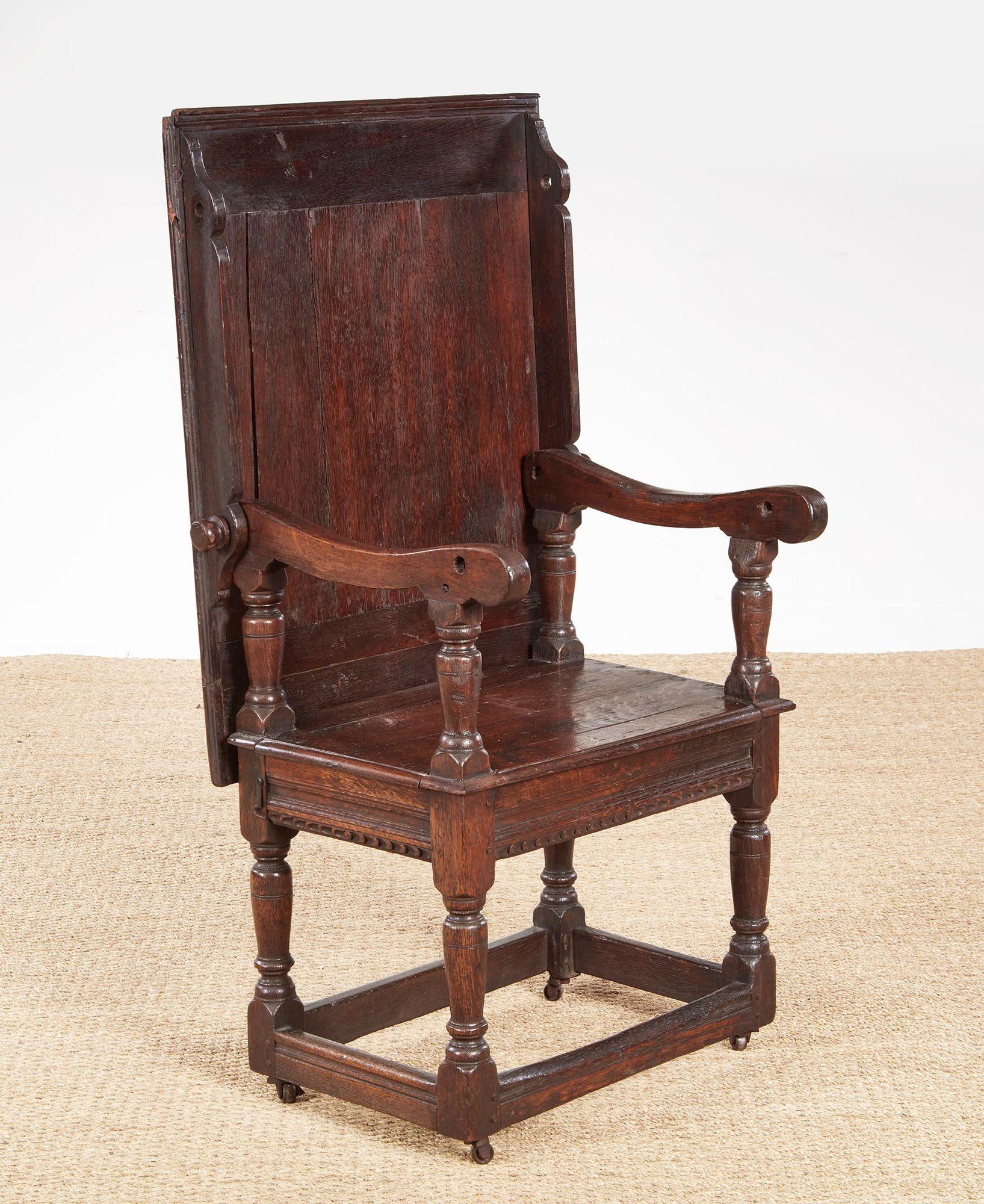 An early English Carolean metamorphic table from the reign of Charles II in desirable bog oak having a boarded top over an undertier on sturdy turned legs joined by lower square section box stretcher.  Readily convertible using removable pins from