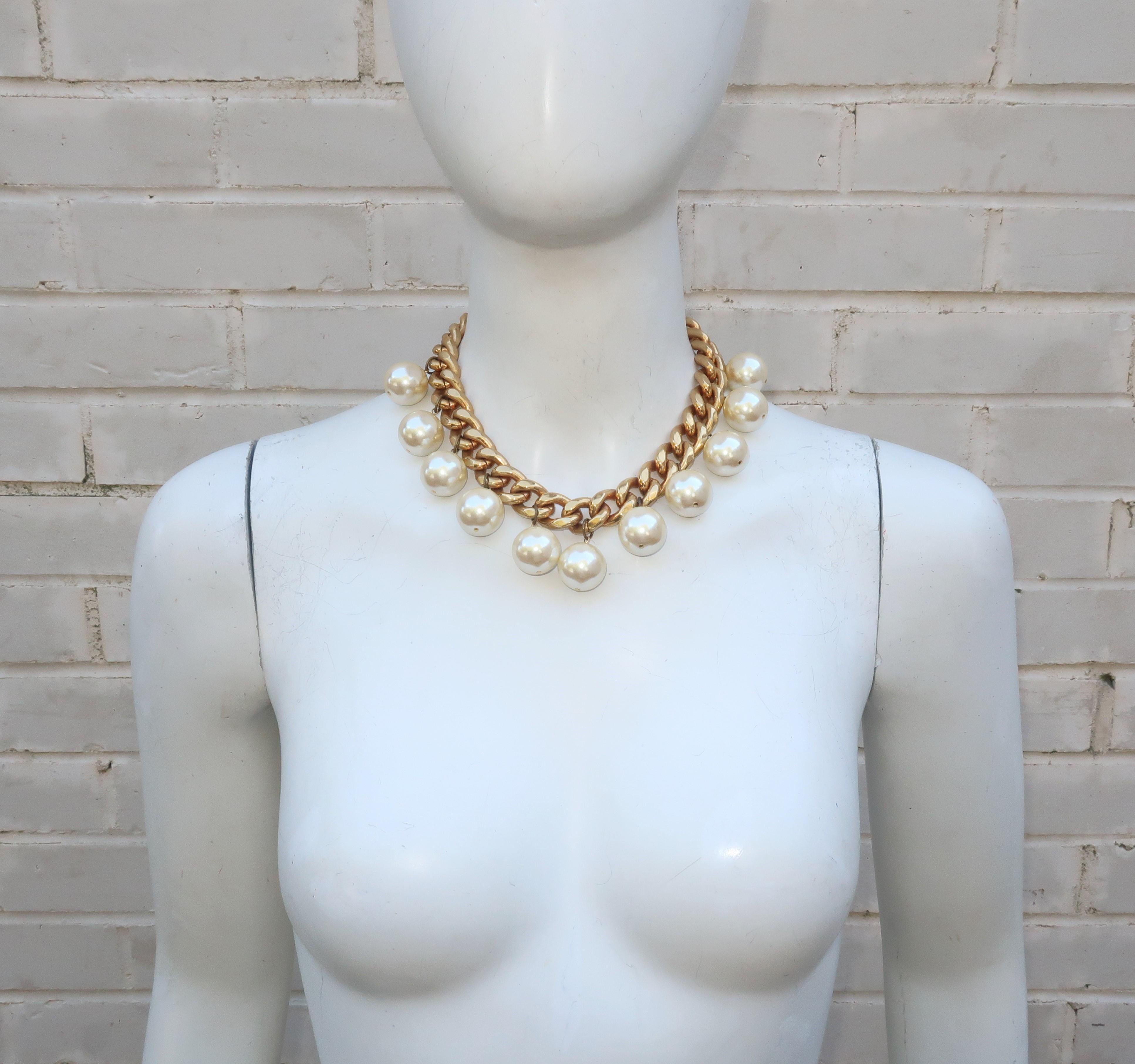 Carolee has been a trendsetting costume jewelry company since the 1970’s.  This 1980's chunky chain necklace is a short choker style length with large pearl dangles that put the charm in charming.  It securely fits with an easy toggle closure.  The
