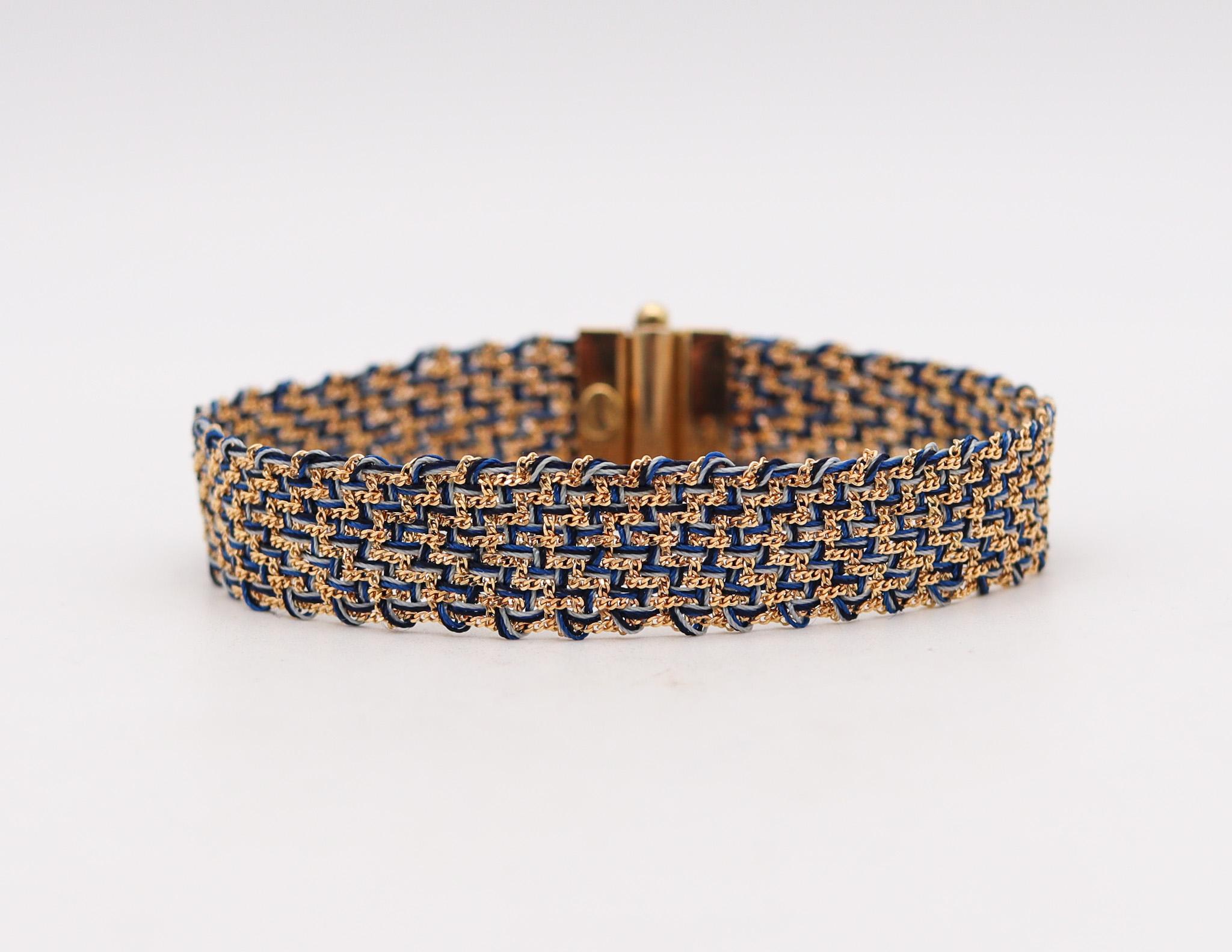 Woven thread wrap bracelet designed by Carolina Bucci.

Beautiful iconic thread bracelet, created in Firenze Italy by the jewelry designer Carolina Bucci. It was crafted from woven blue silk and yellow gold of 18 karats, with high polished finish.
