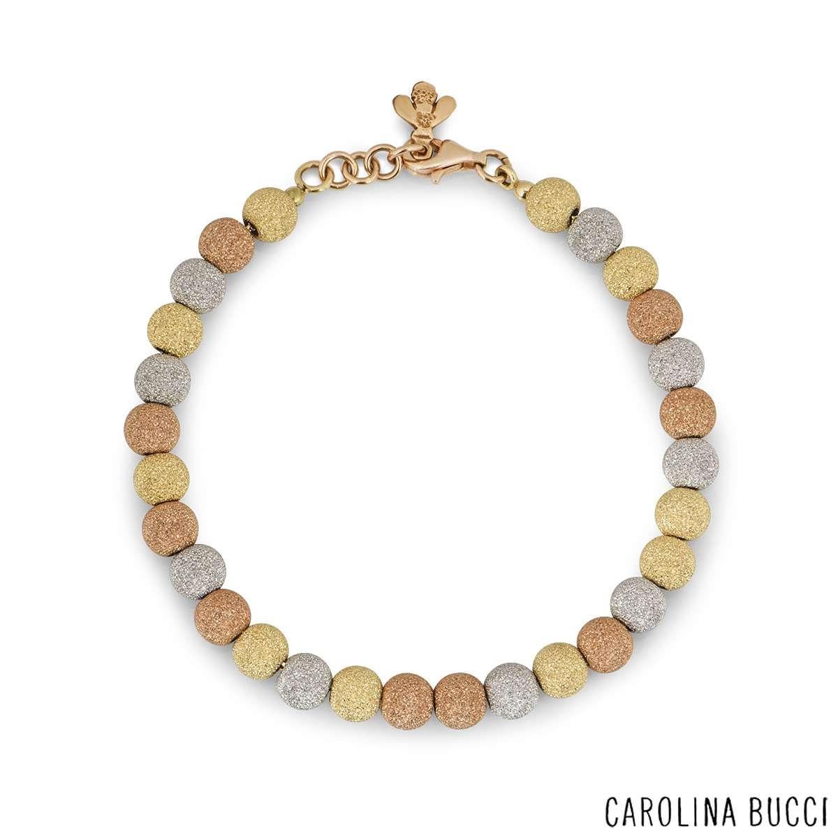 An 18k tri-colour gold bracelet from the Florentine collection by Carolina Bucci. The bracelet has 28 beads in yellow, rose and white gold with a sparkly, textured finish. The bracelet measures 7 inches in length and has a lobster clasp with a bee